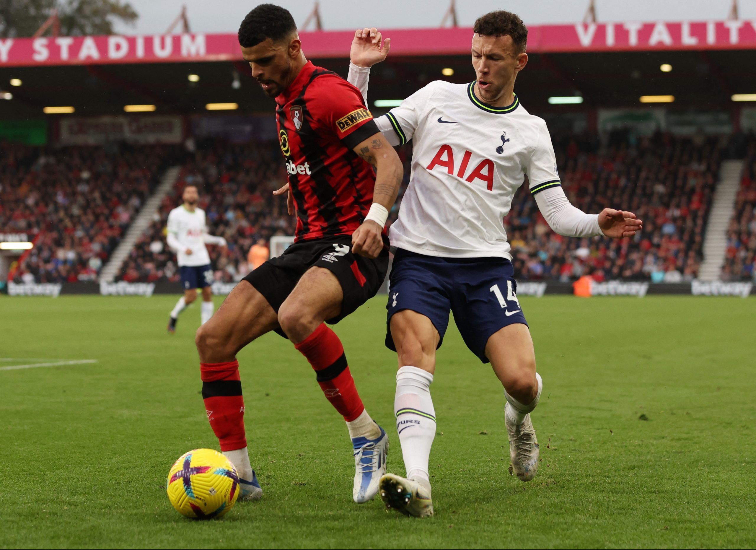 Soccer Football - Premier League - AFC Bournemouth v Tottenham Hotspur - Vitality Stadium, Bournemouth, Britain - October 29, 2022 AFC Bournemouth's Dominic Solanke in action with Tottenham Hotspur's Ivan Perisic Action Images via Reuters/Paul Childs EDITORIAL USE ONLY. No use with unauthorized audio, video, data, fixture lists, club/league logos or 'live' services. Online in-match use limited to 75 images, no video emulation. No use in betting, games or single club /league/player publications. 