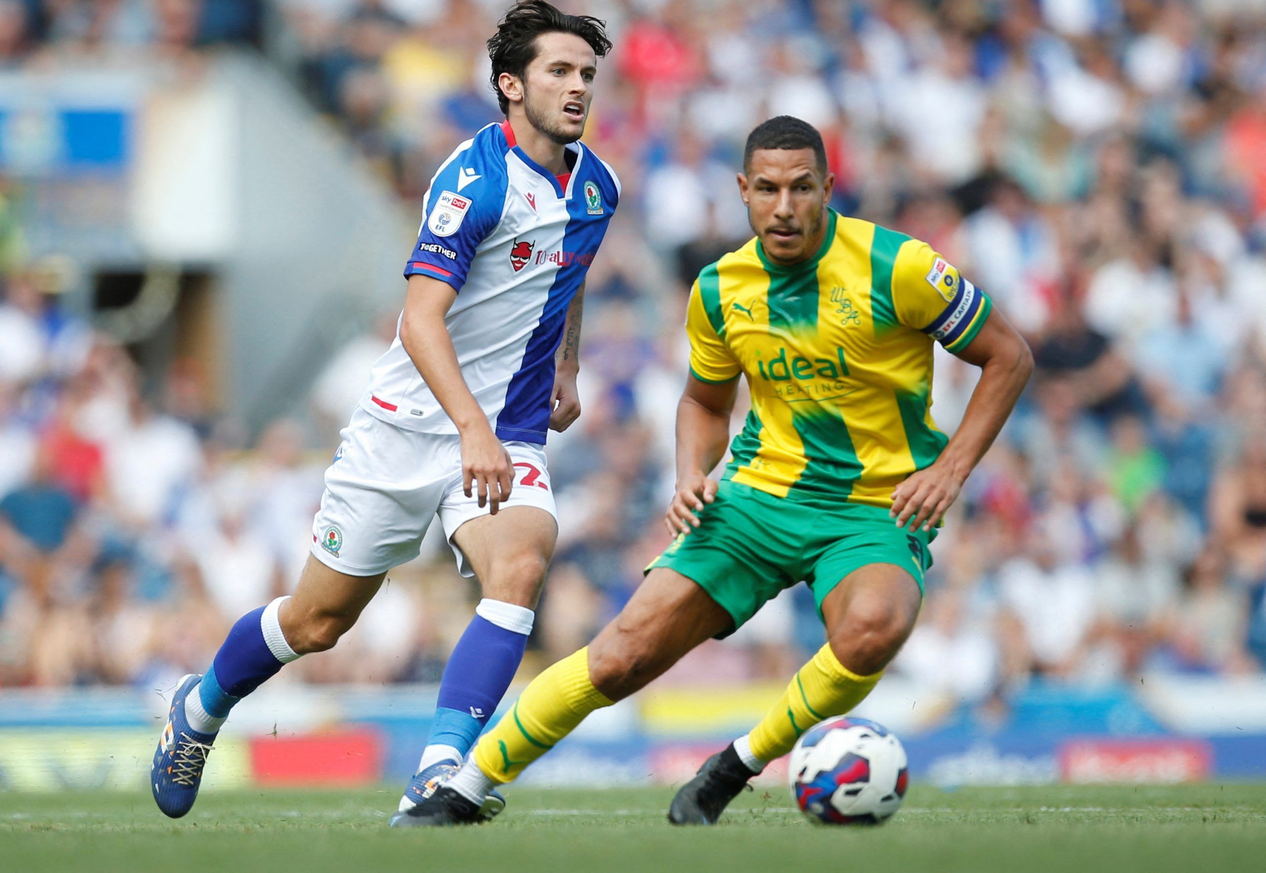 Soccer Football - Championship - Blackburn Rovers v West Bromwich Albion - Ewood Park, Blackburn, Britain - August 14, 2022 Blackburn Rovers' Lewis Travis in action with West Bromwich Albion's Jake Livermore  Action Images/Ed Sykes  EDITORIAL USE ONLY. No use with unauthorized audio, video, data, fixture lists, club/league logos or 