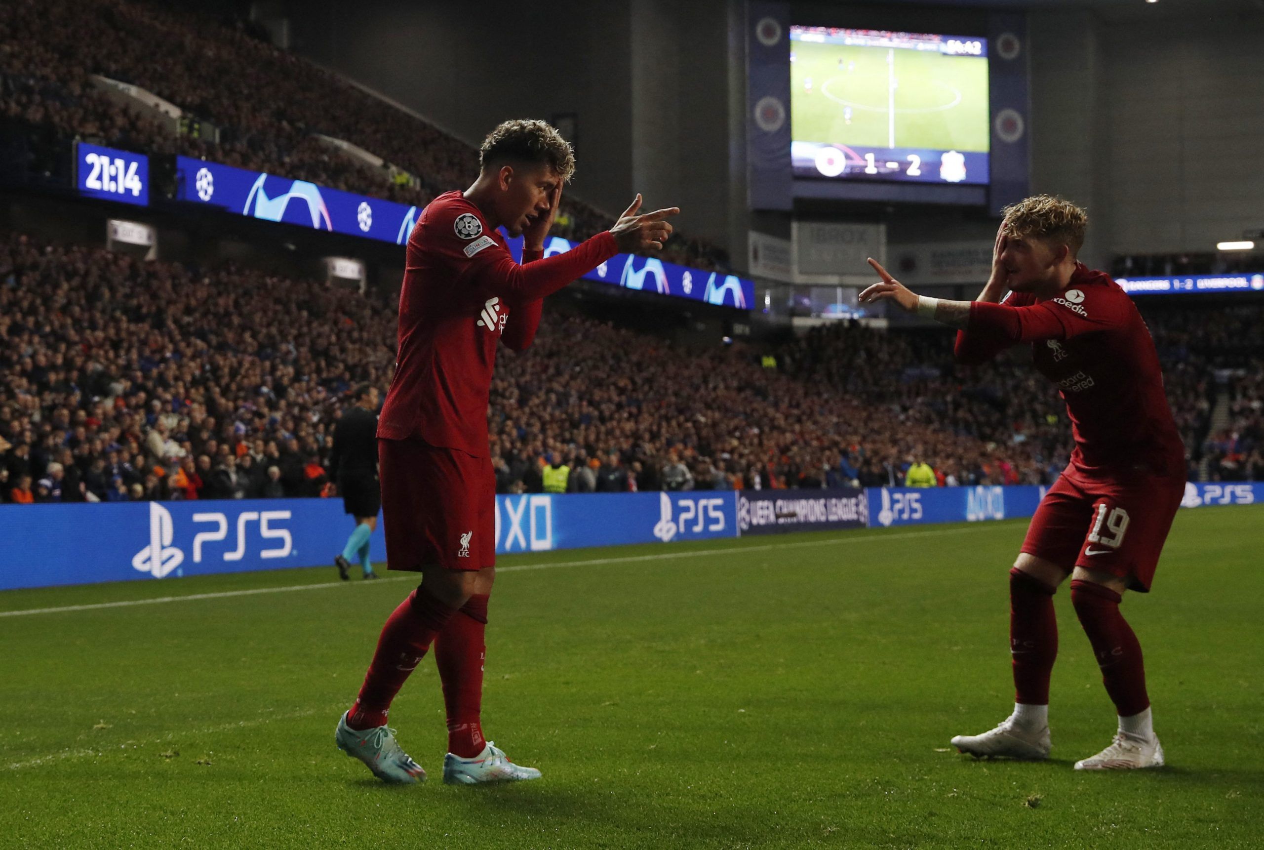 Soccer Football - Champions League - Group A - Rangers v Liverpool - Ibrox Stadium, Glasgow, Scotland, Britain - October 12, 2022  Liverpool's Roberto Firmino celebrates scoring their second goal with Harvey Elliott Action Images via Reuters/Lee Smith
