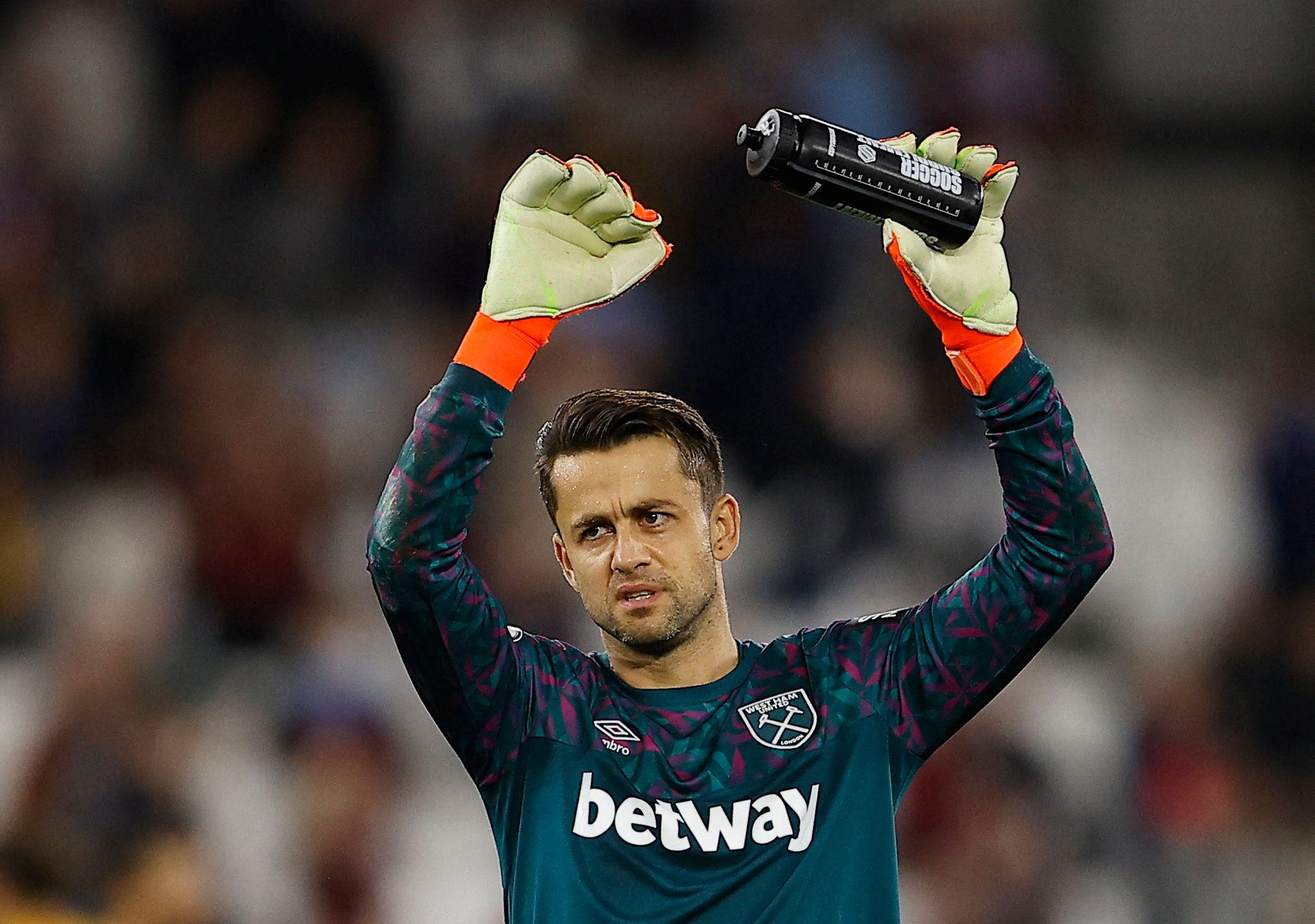 Soccer Football - Premier League - West Ham United v Wolverhampton Wanderers - London Stadium, London, Britain - October 1, 2022 West Ham United's Lukasz Fabianski celebrates after the match REUTERS/Peter Nicholls EDITORIAL USE ONLY. No use with unauthorized audio, video, data, fixture lists, club/league logos or 'live' services. Online in-match use limited to 75 images, no video emulation. No use in betting, games or single club /league/player publications.  Please contact your account represen