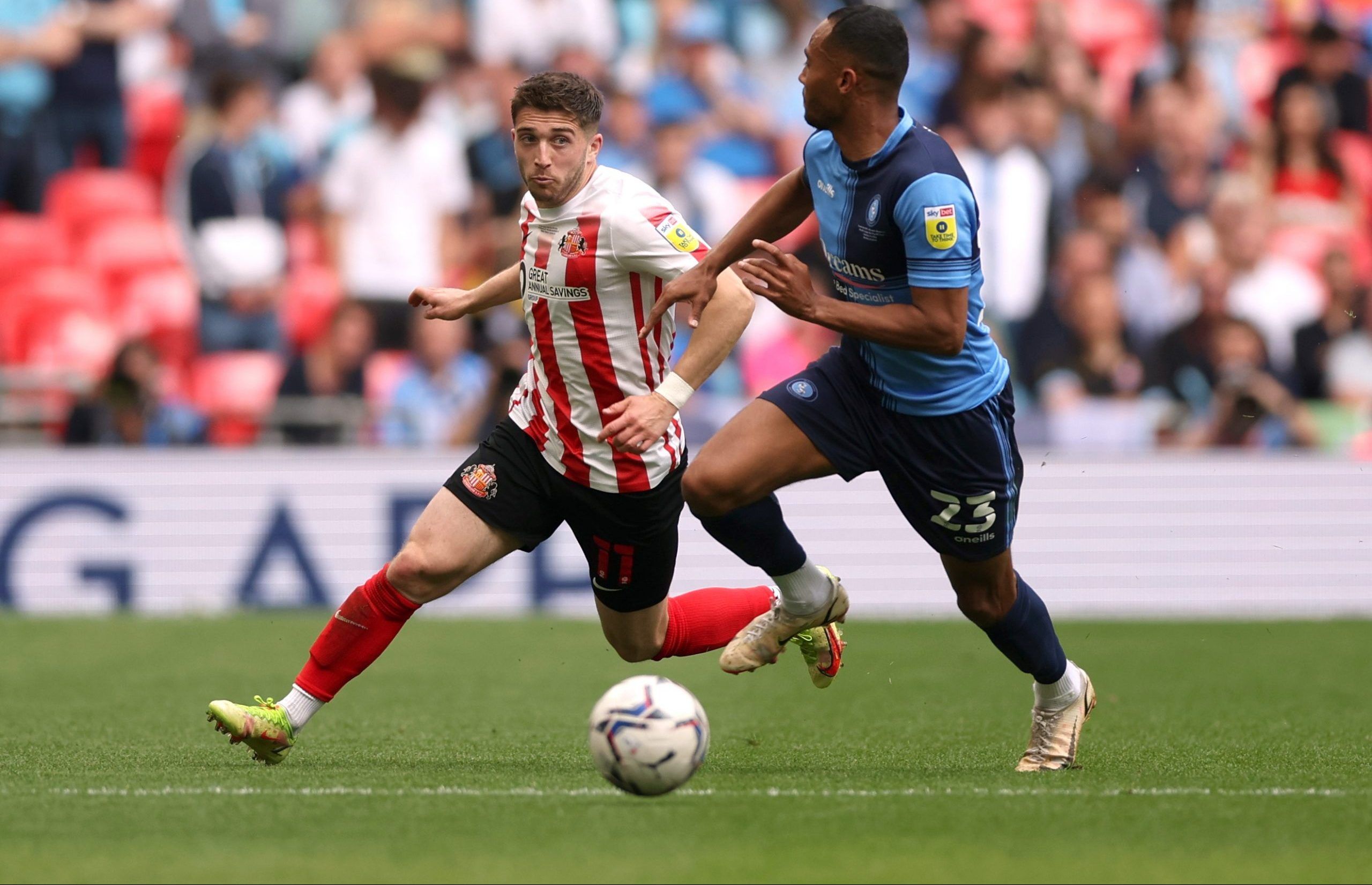 Soccer Football - League One Play-Off Final - Sunderland v Wycombe Wanderers - Wembley Stadium, London, Britain - May 21, 2022  Sunderland's Lynden Gooch in action with Wycombe Wanderers' Jordan Obita Action Images/Matthew Childs EDITORIAL USE ONLY. No use with unauthorized audio, video, data, fixture lists, club/league logos or 'live' services. Online in-match use limited to 75 images, no video emulation. No use in betting, games or single club /league/player publications.  Please contact your 