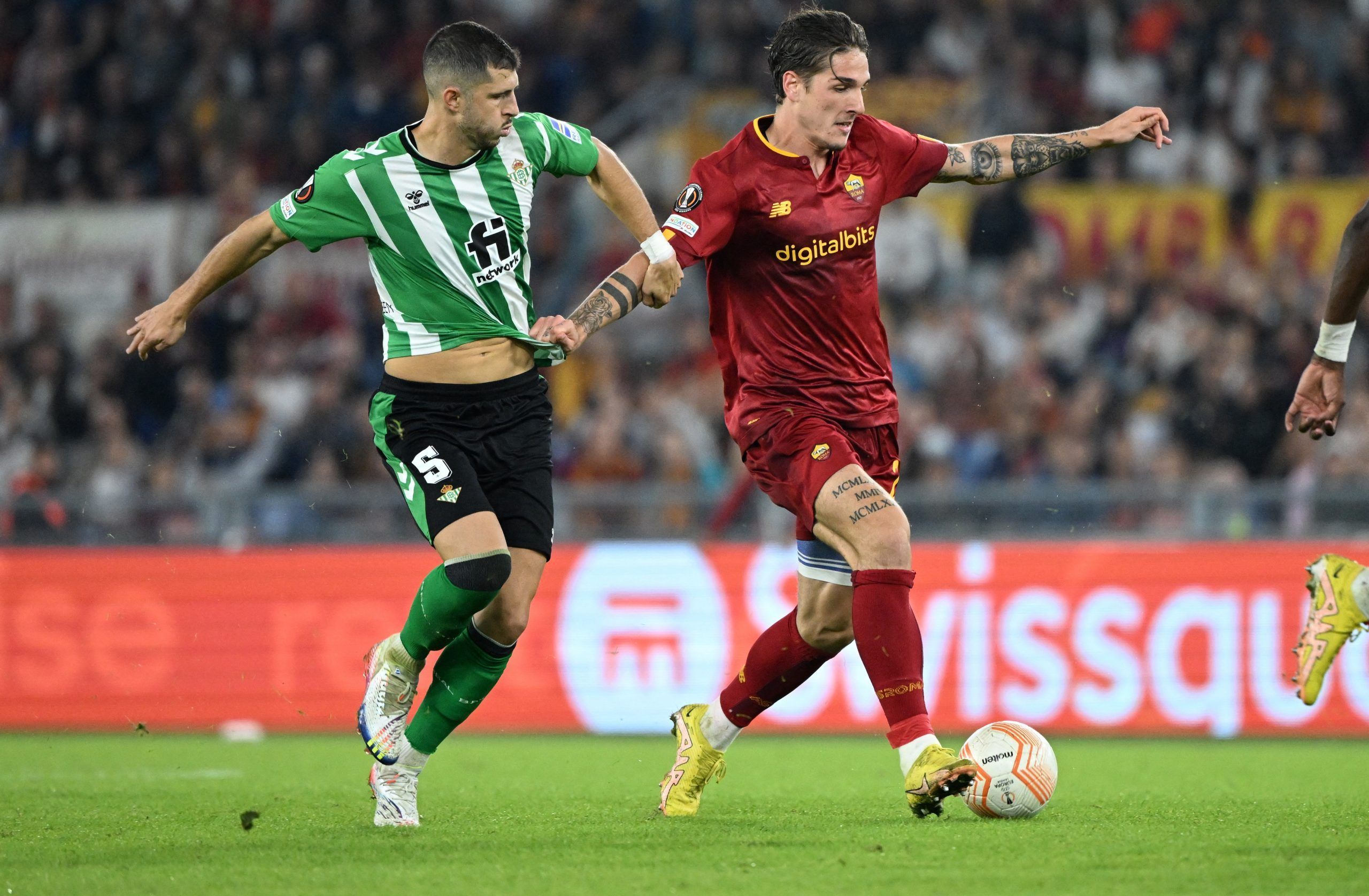 Soccer Football - Europa League - Group C - AS Roma v Real Betis - Stadio Olimpico, Rome, Italy - October 6, 2022  Real Betis' Guido Rodriguez in action with AS Roma's Nicolo Zaniolo REUTERS/Alberto Lingria