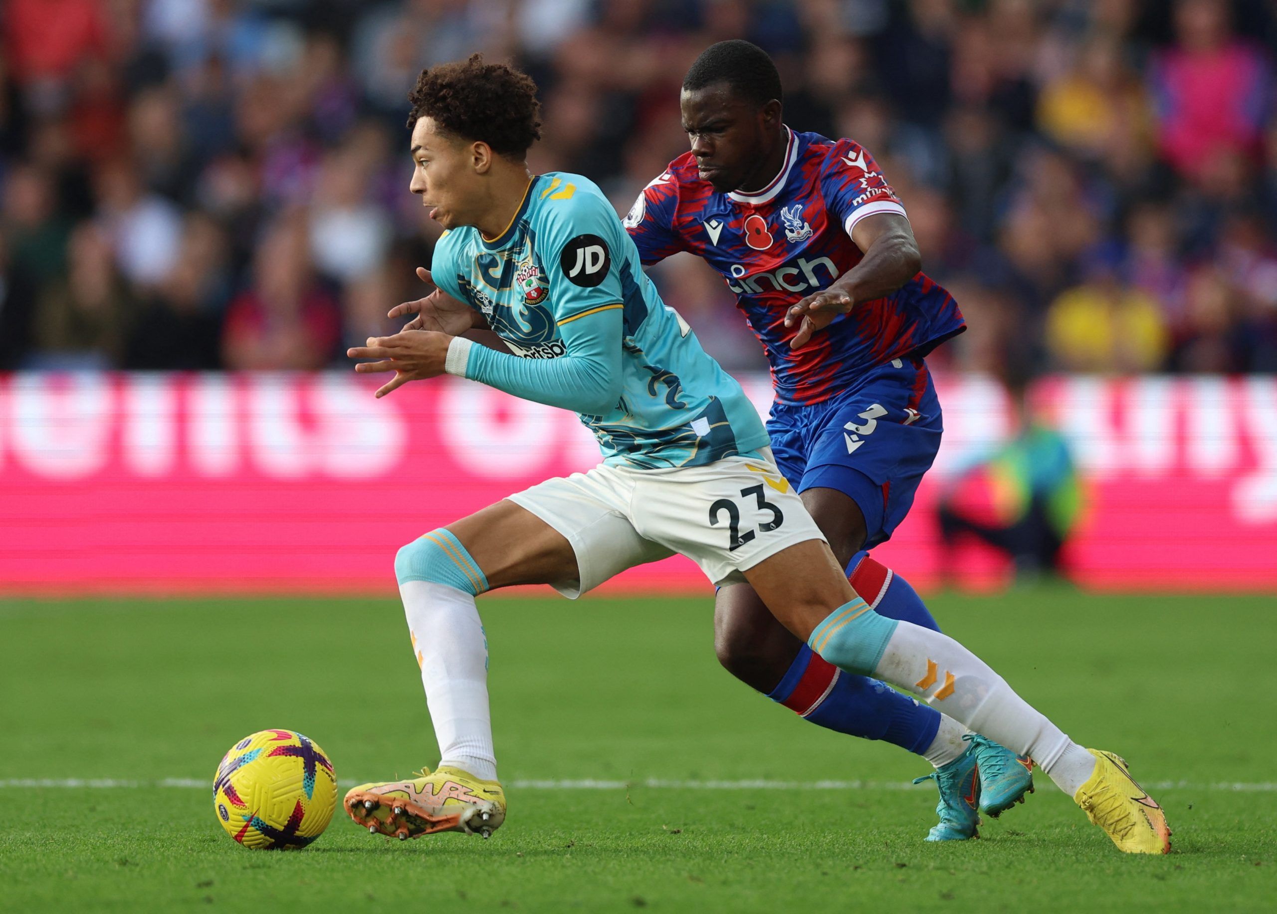 Soccer Football - Premier League - Crystal Palace v Southampton - Selhurst Park, London, Britain - October 29, 2022 Southampton's Samuel Edozie in action with Crystal Palace's Tyrick Mitchell Action Images via Reuters/Matthew Childs EDITORIAL USE ONLY. No use with unauthorized audio, video, data, fixture lists, club/league logos or 'live' services. Online in-match use limited to 75 images, no video emulation. No use in betting, games or single club /league/player publications.  Please contact yo