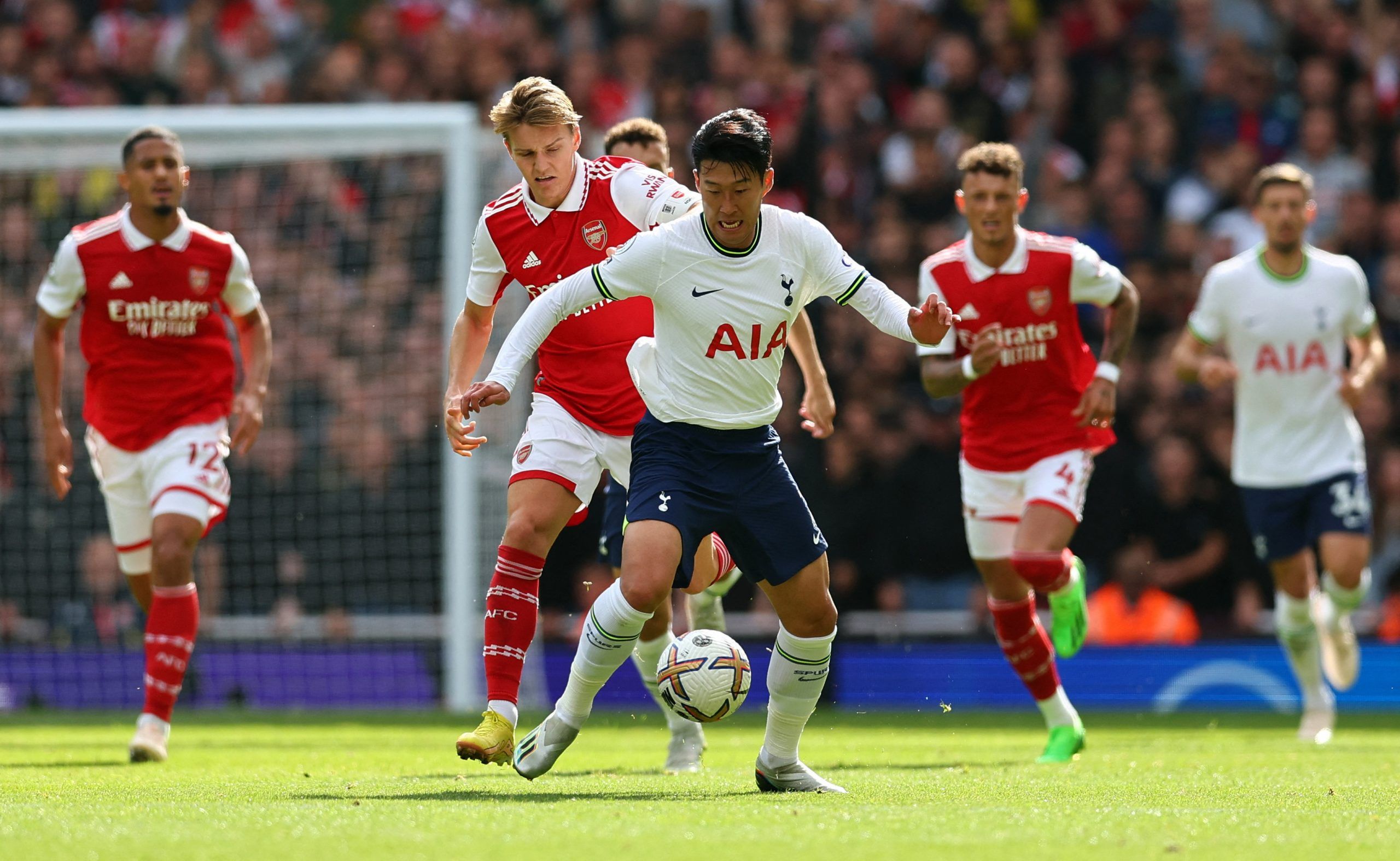 Tottenham Hotspur's Son Heung-min in action with Arsenal's Martin Odegaard
