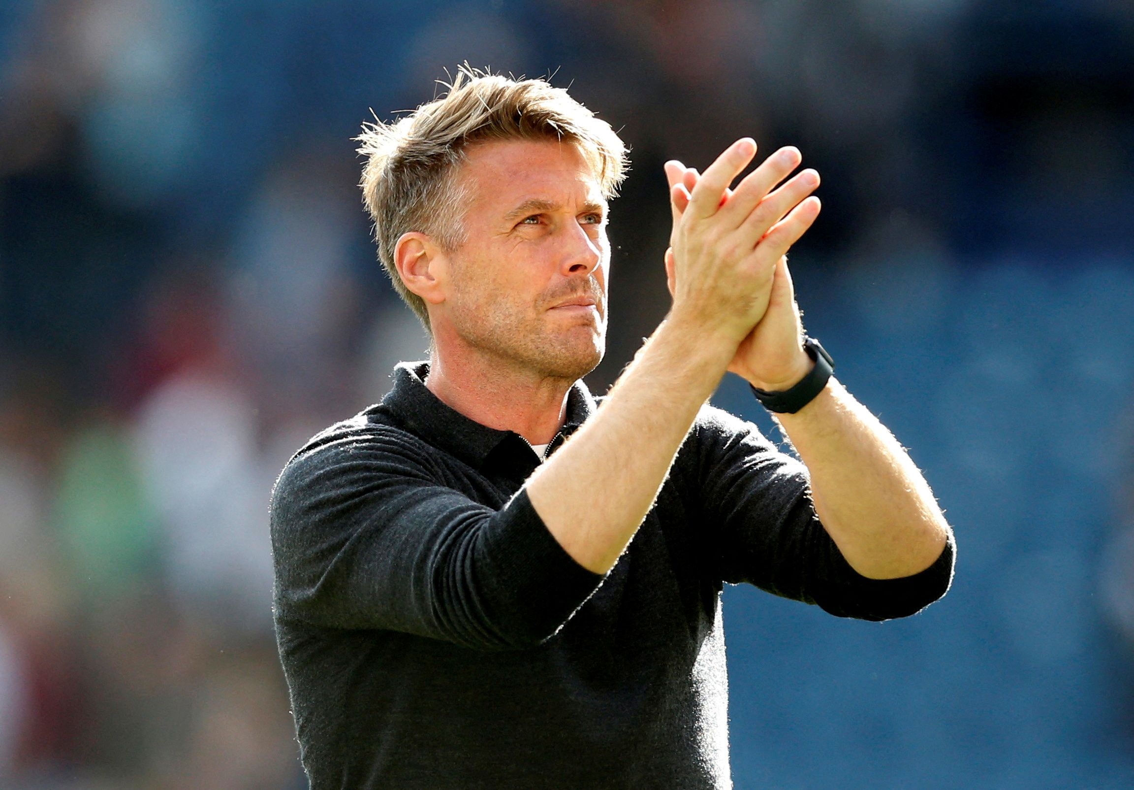 Watford manager Rob Edwards applauds the fans after the match 