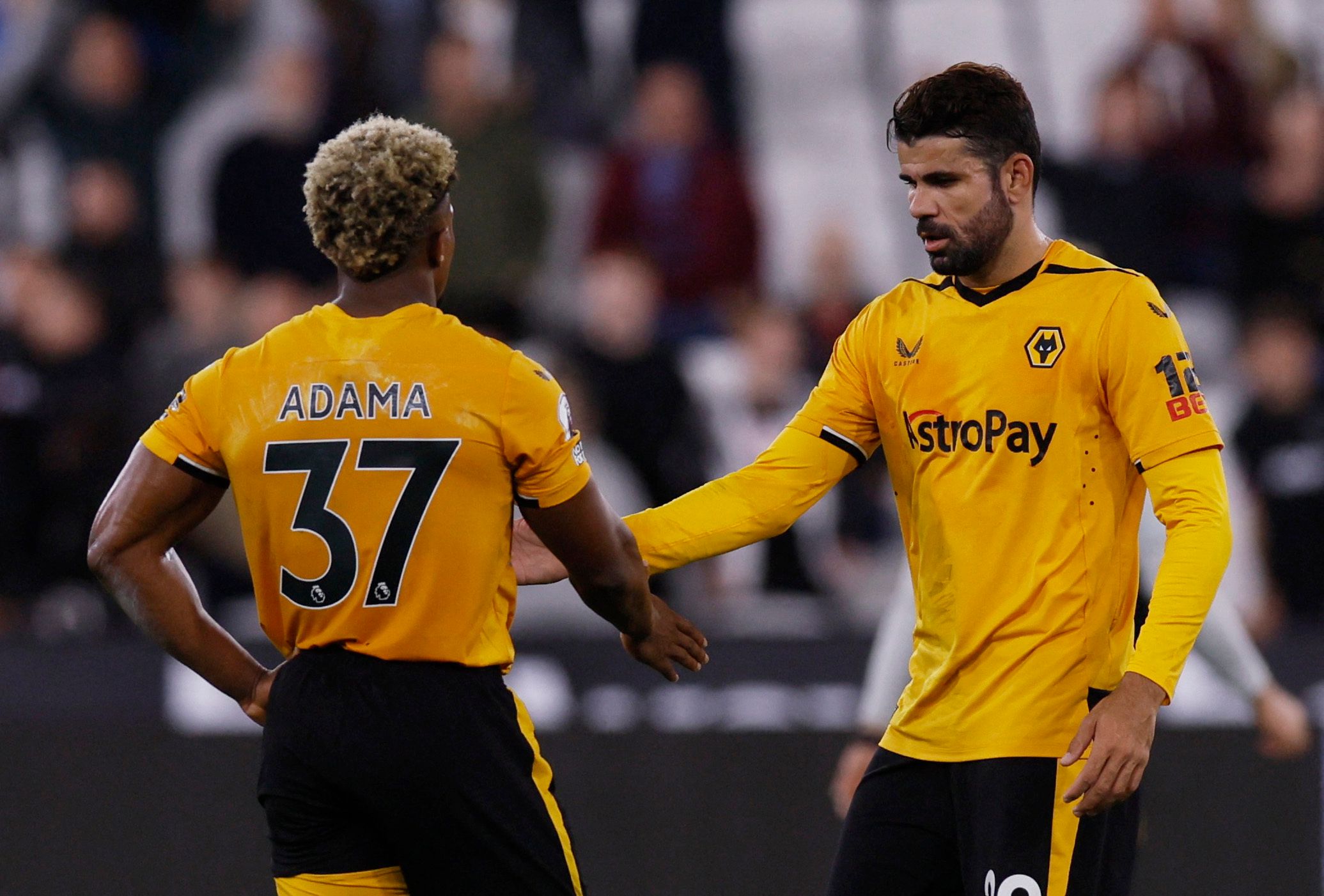 Soccer Football - Premier League - West Ham United v Wolverhampton Wanderers - London Stadium, London, Britain - October 1, 2022 Wolverhampton Wanderers' Adama Traore shakes hands with Diego Costa after the match Action Images via Reuters/Andrew Couldridge EDITORIAL USE ONLY. No use with unauthorized audio, video, data, fixture lists, club/league logos or 'live' services. Online in-match use limited to 75 images, no video emulation. No use in betting, games or single club /league/player publicat