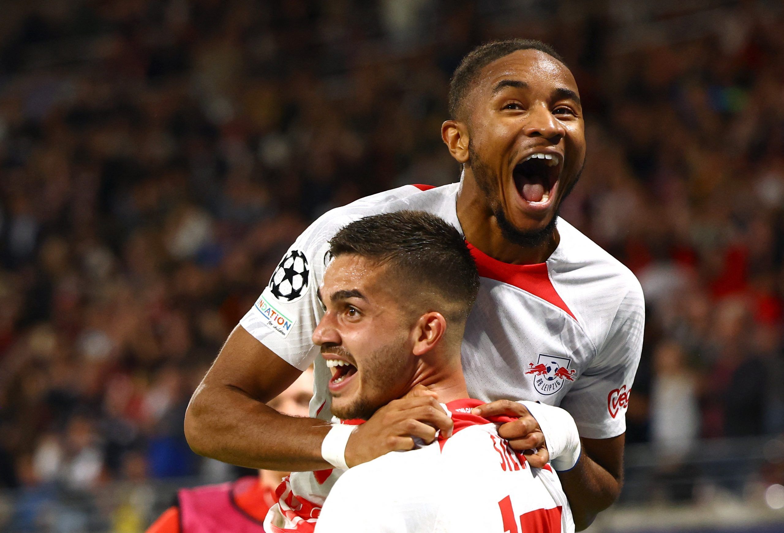 Soccer Football - Champions League - Group F - RB Leipzig v Celtic - Red Bull Arena, Leipzig, Germany - October 5, 2022 RB Leipzig's Andre Silva celebrates scoring their third goal with Christopher Nkunku REUTERS/Lisi Niesner