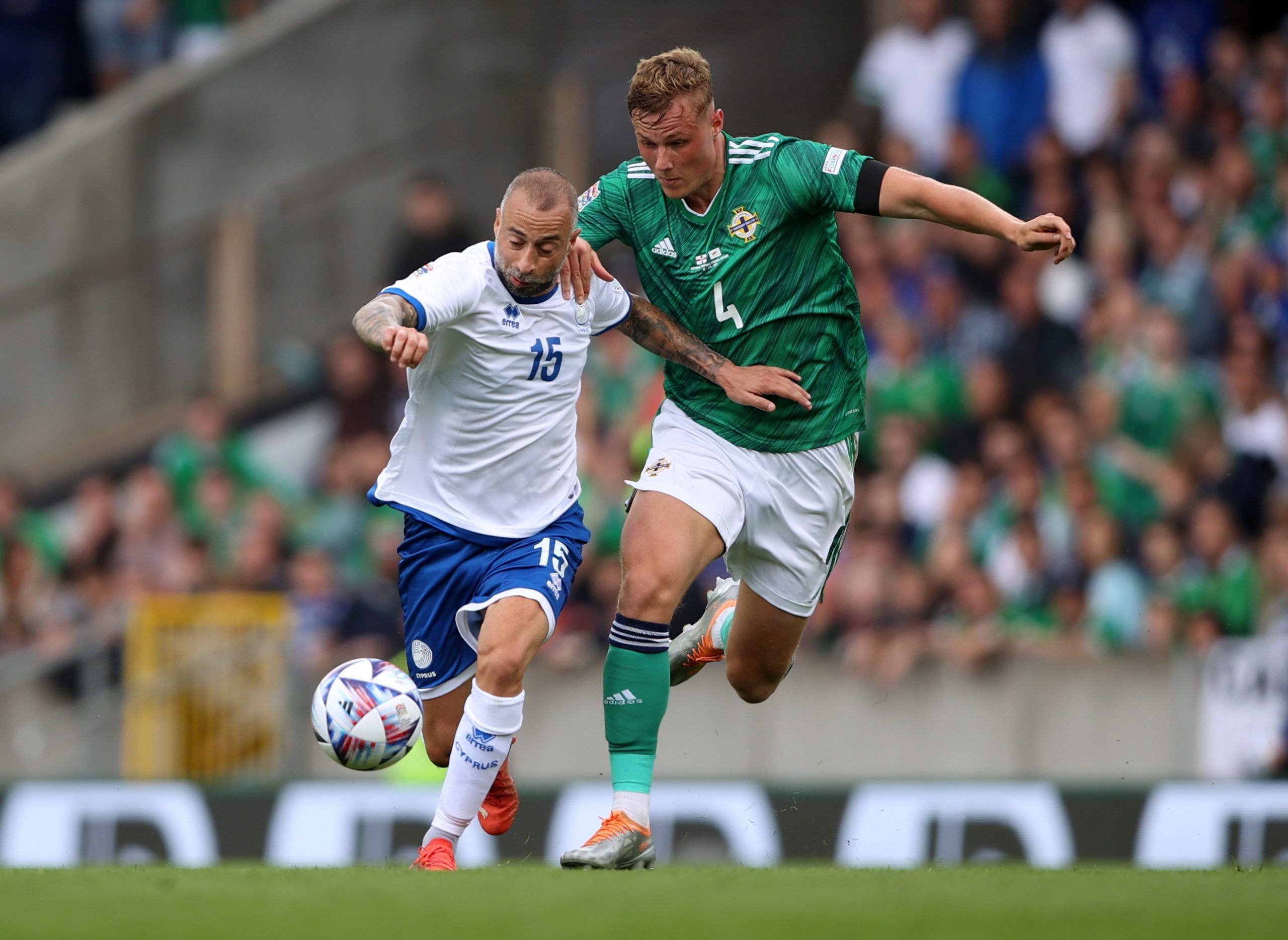 Soccer Football - UEFA Nations League - Group J - Northern Ireland v Cyprus - Windsor Park, Belfast, Northern Ireland, Britain - June 12, 2022 Cyprus' Fotis Papoulis in action with Northern Ireland's Daniel Ballard Action Images via Reuters/Molly Darlington