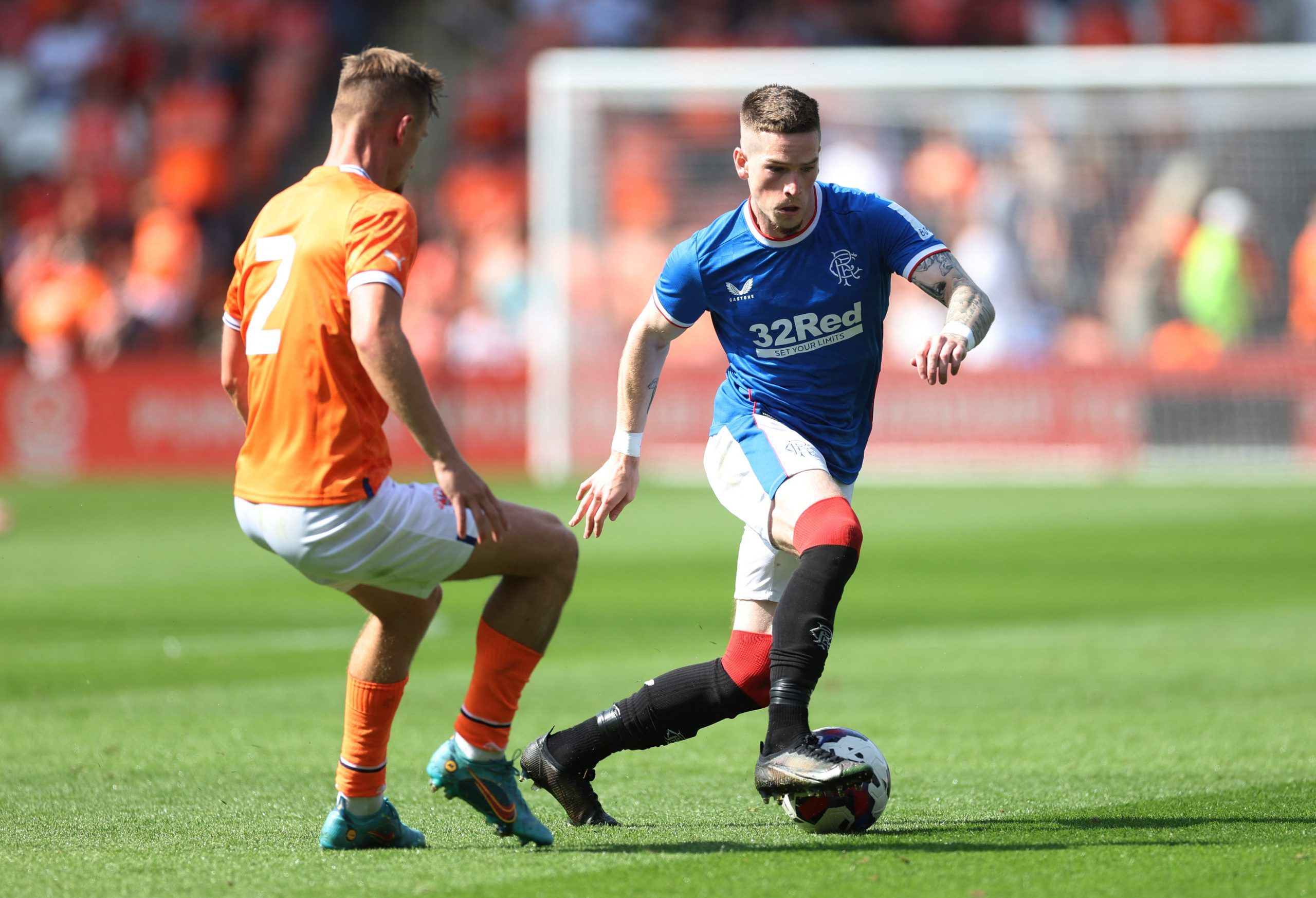 Soccer Football - Pre Season Friendly - Blackpool v Rangers - Bloomfield Road, Blackpool, Britain - July 16, 2022 Rangers' Ryan Kent in action with Blackpool's Callum Connolly Action Images via Reuters/Carl Recine
