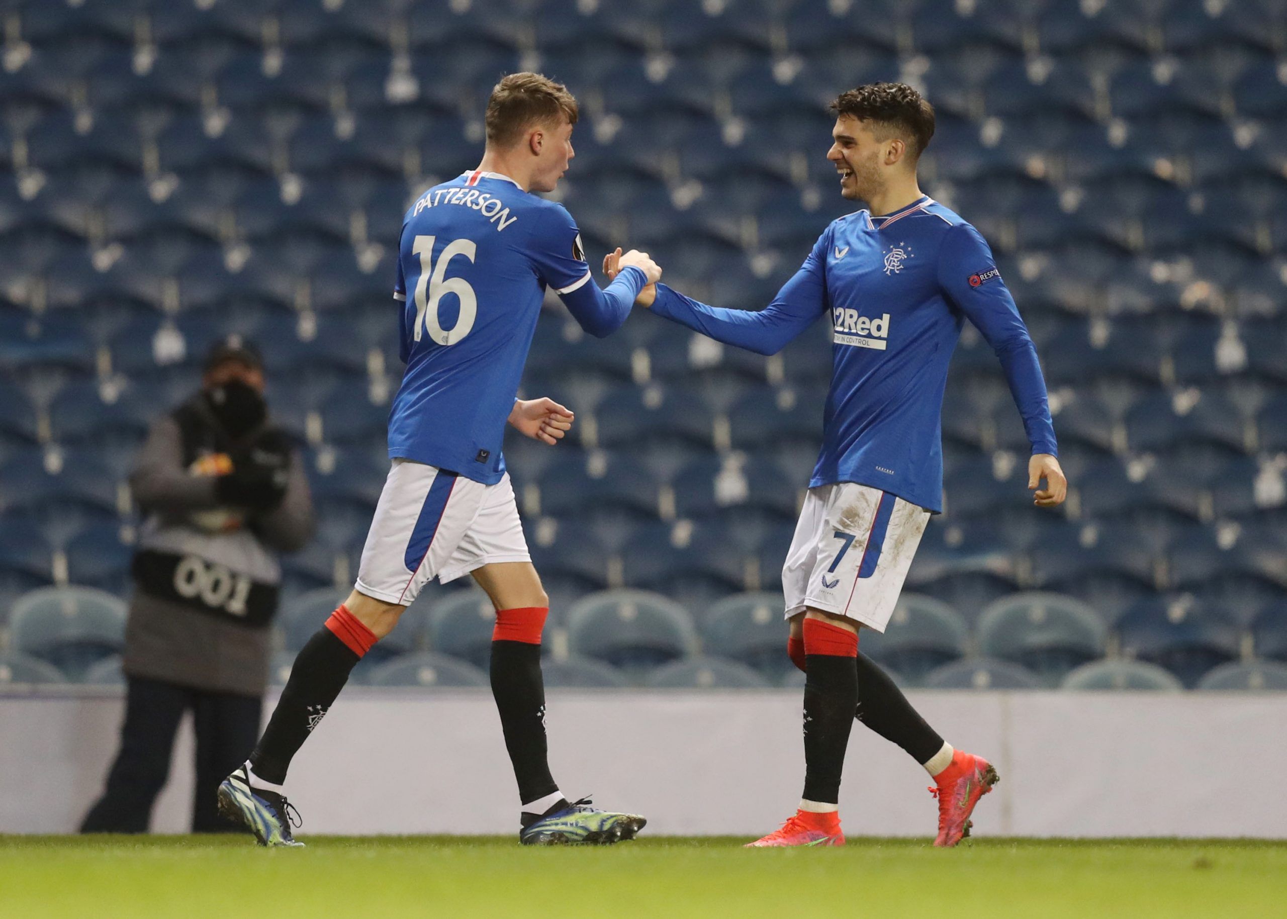 Soccer Football - Europa League - Round of 32 Second Leg - Rangers v Royal Antwerp - Ibrox, Glasgow, Scotland, Britain - February 25, 2021 Rangers' Nathan Patterson celebrates scoring their second goal with Ianis Hagi Pool via REUTERS/Russell Cheyne