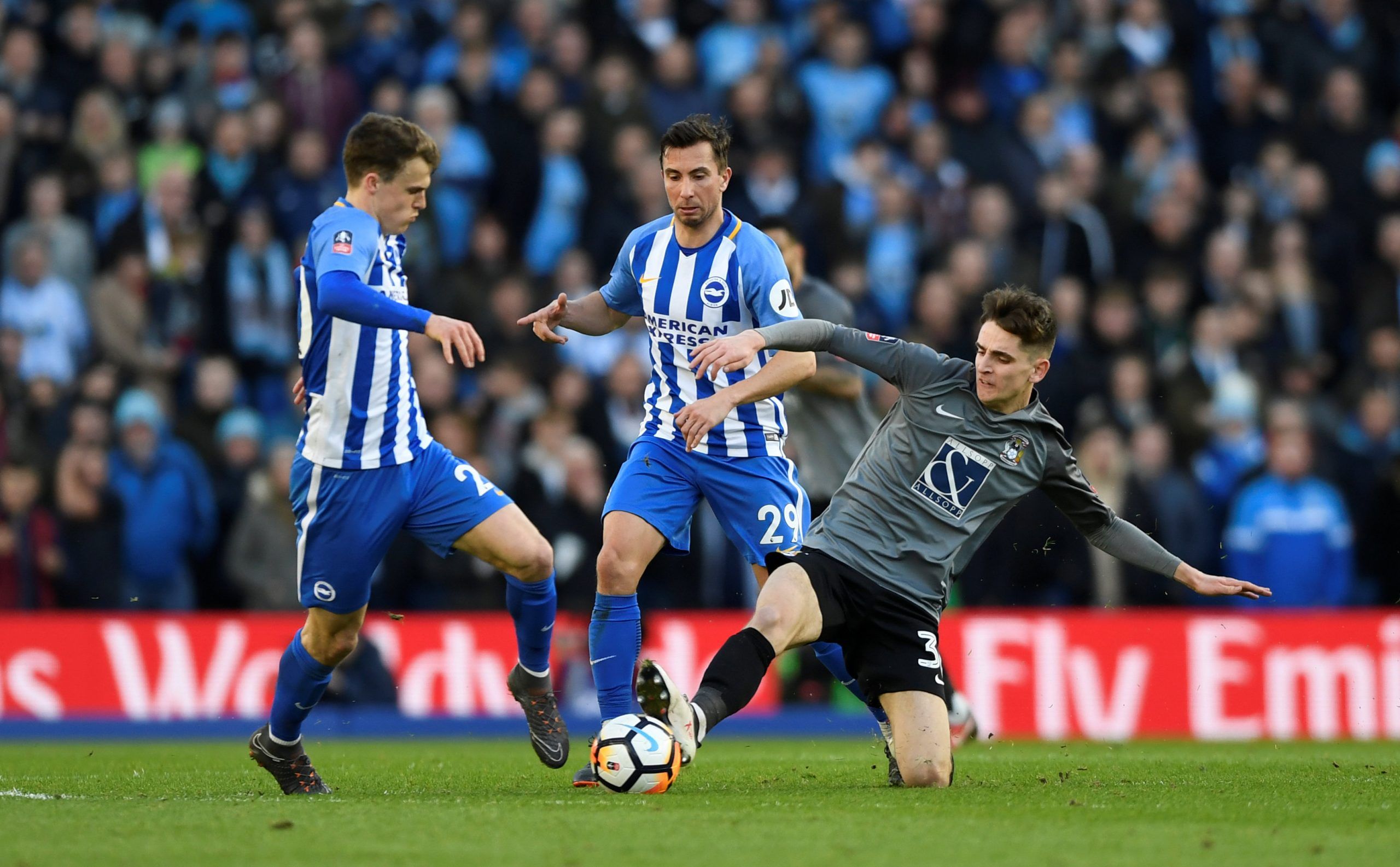 Soccer Football - FA Cup Fifth Round - Brighton &amp; Hove Albion vs Coventry City - The American Express Community Stadium, Brighton, Britain - February 17, 2018   Brighton’s Solly March and Markus Suttner in action with Coventry City’s Tom Bayliss           Action Images via Reuters/Tony O'Brien
