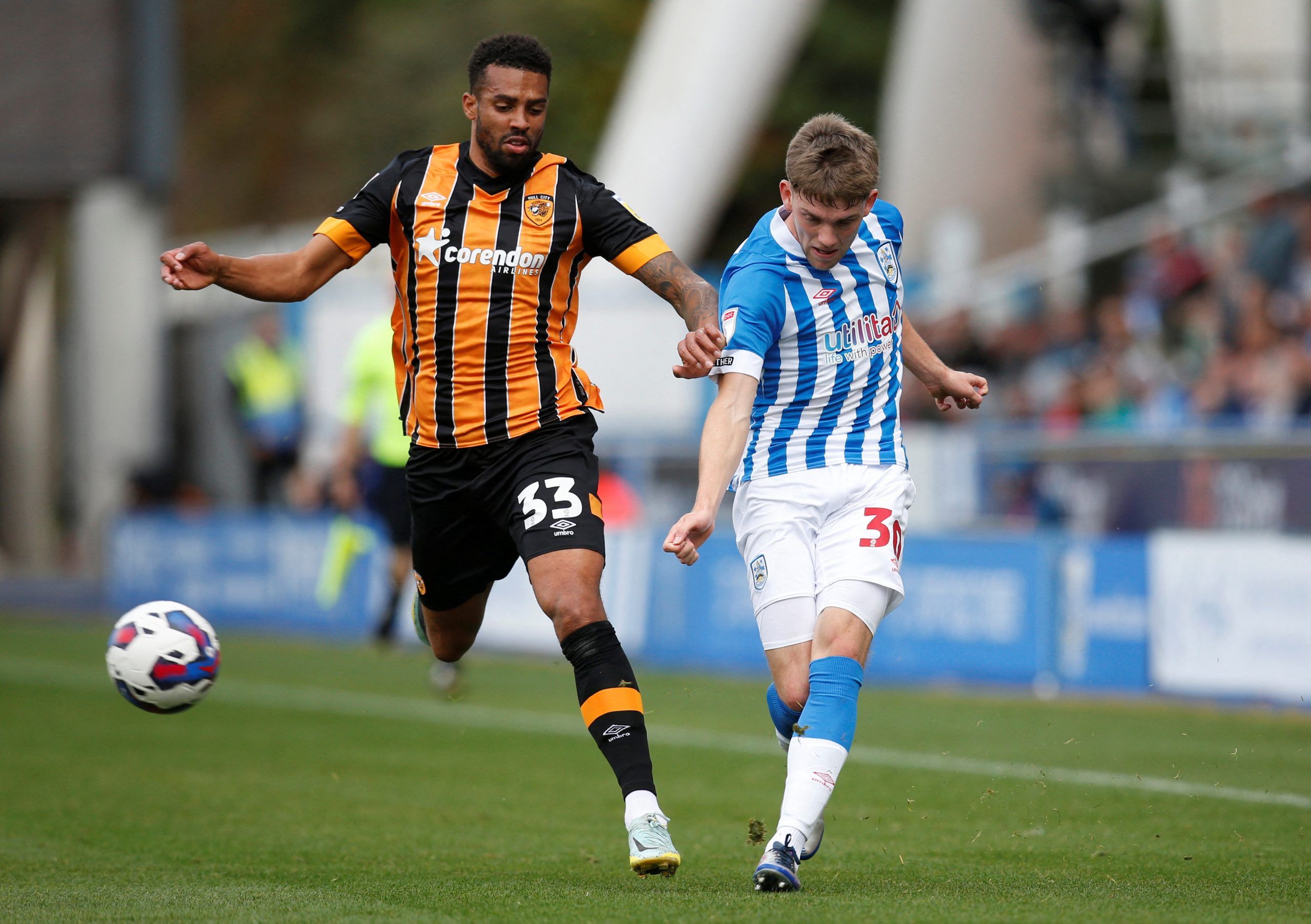 Soccer Football - Championship - Huddersfield Town v Hull City - John Smith's Stadium, Huddersfield, Britain - October 9, 2022 Hull City's Cyrus Christie in action with Huddersfield Town's Ben Jackson  Action Images/Ed Sykes  EDITORIAL USE ONLY. No use with unauthorized audio, video, data, fixture lists, club/league logos or 