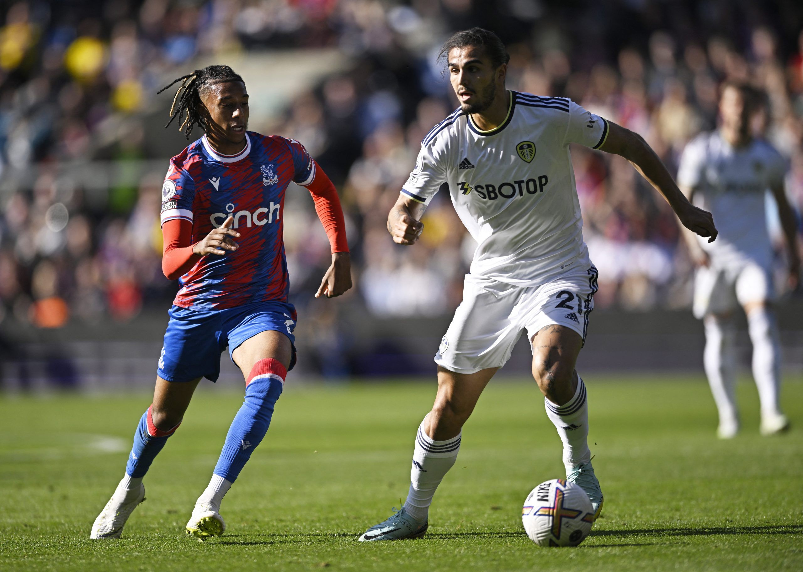 Crystal Palace's Michael Olise in action with Leeds United's Pascal Struijk
