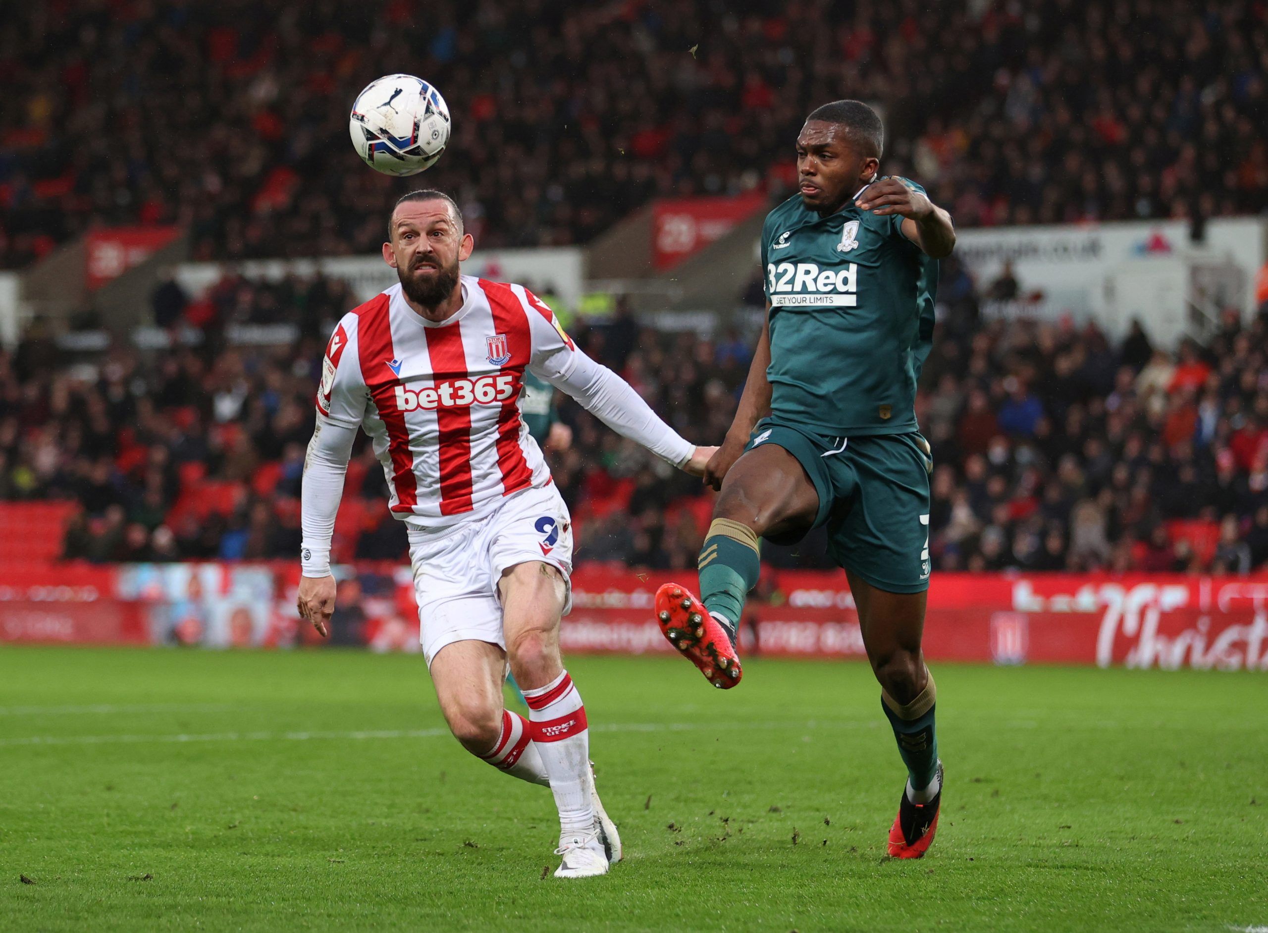 Soccer Football - Championship - Stoke City v Middlesbrough - bet365 Stadium, Stoke-on-Trent, Britain - December 11, 2021  Stoke City's Steven Fletcher in action with Middlesbrough's Anfernee Dijksteel  Action Images/John Clifton  EDITORIAL USE ONLY. No use with unauthorized audio, video, data, fixture lists, club/league logos or 