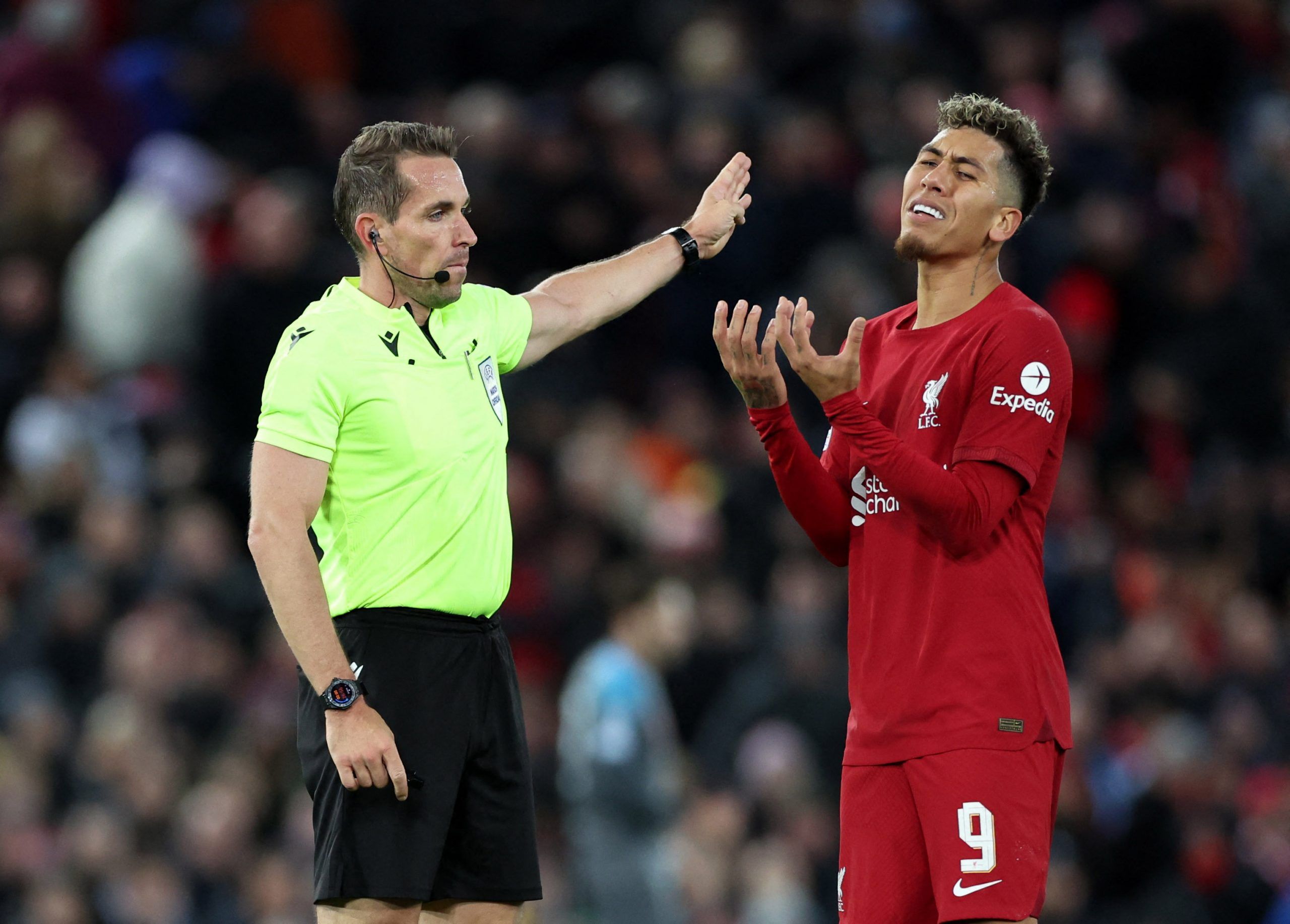 Soccer Football - Champions League - Group A - Liverpool v Napoli - Anfield, Liverpool, Britain - November 1, 2022 Liverpool's Roberto Firmino reacts as referee Tobias Stieler looks on REUTERS/Carl Recine