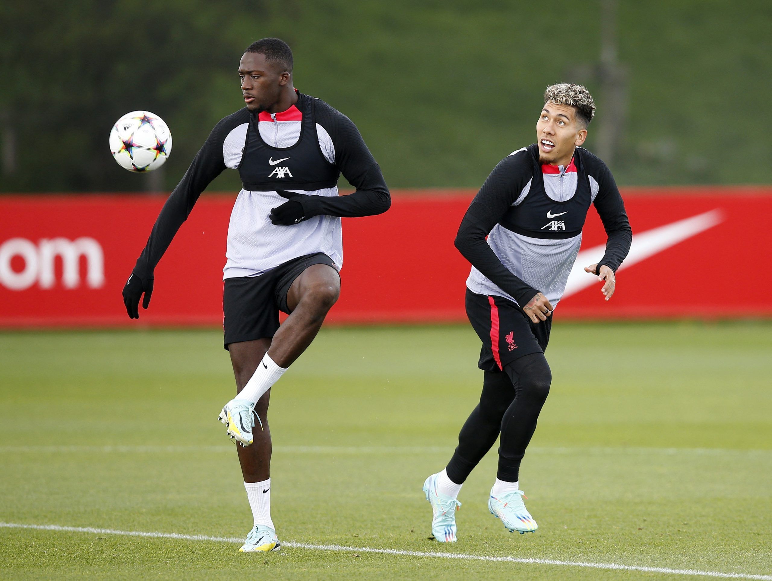Soccer Football - Champions League - Liverpool Training - AXA Training Centre, Liverpool, Britain - October 11, 2022 Liverpool's Ibrahima Konate and Roberto Firmino during training Action Images via Reuters/Craig Brough