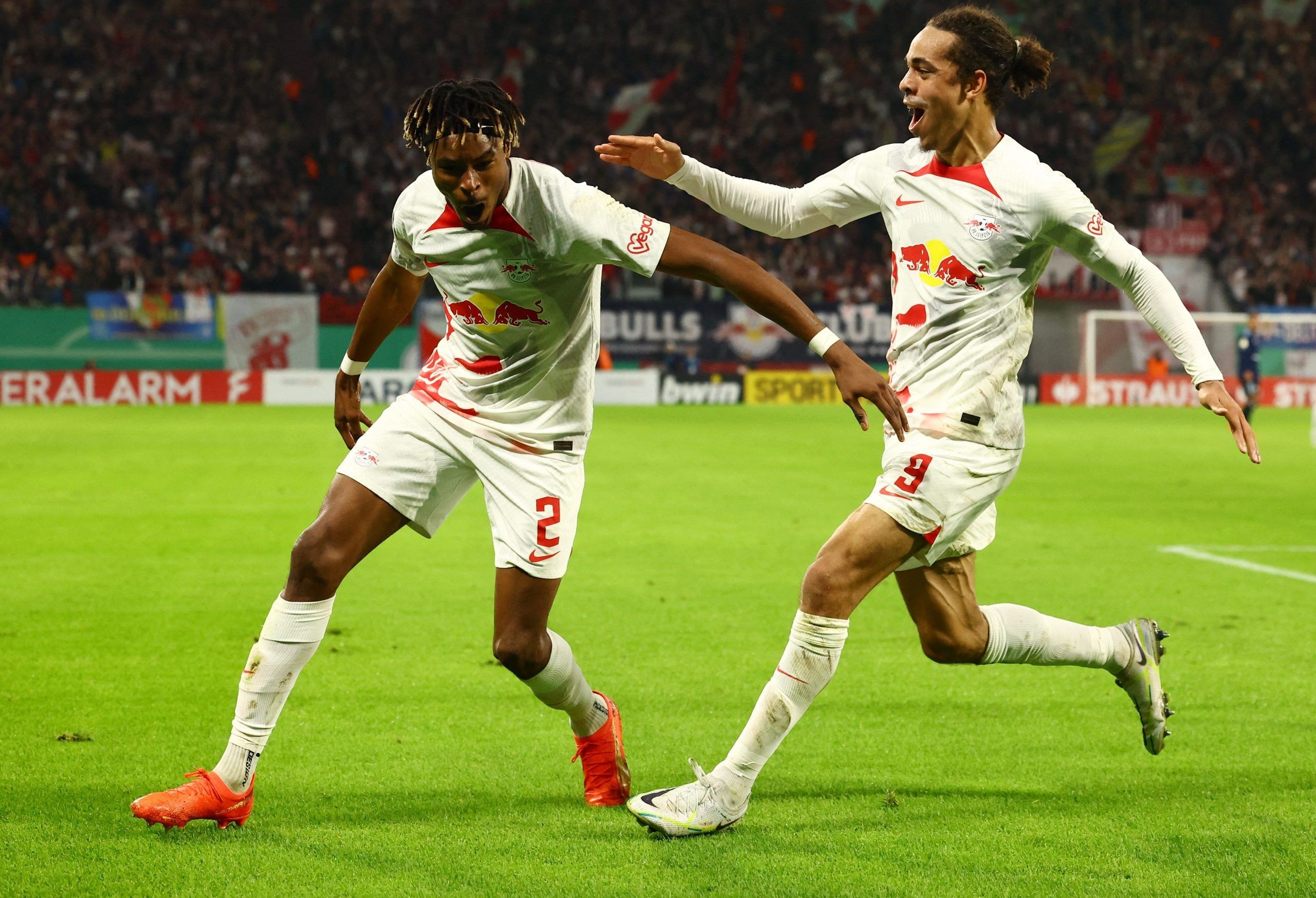 Soccer Football - DFB Cup - Second Round - RB Leipzig v Hamburger SV - Red Bull Arena, Leipzig, Germany - October 18, 2022 RB Leipzig's Yussuf Poulsen celebrates scoring their first goal with Mohamed Simakan REUTERS/Lisi Niesner DFB REGULATIONS PROHIBIT ANY USE OF PHOTOGRAPHS AS IMAGE SEQUENCES AND/OR QUASI-VIDEO.