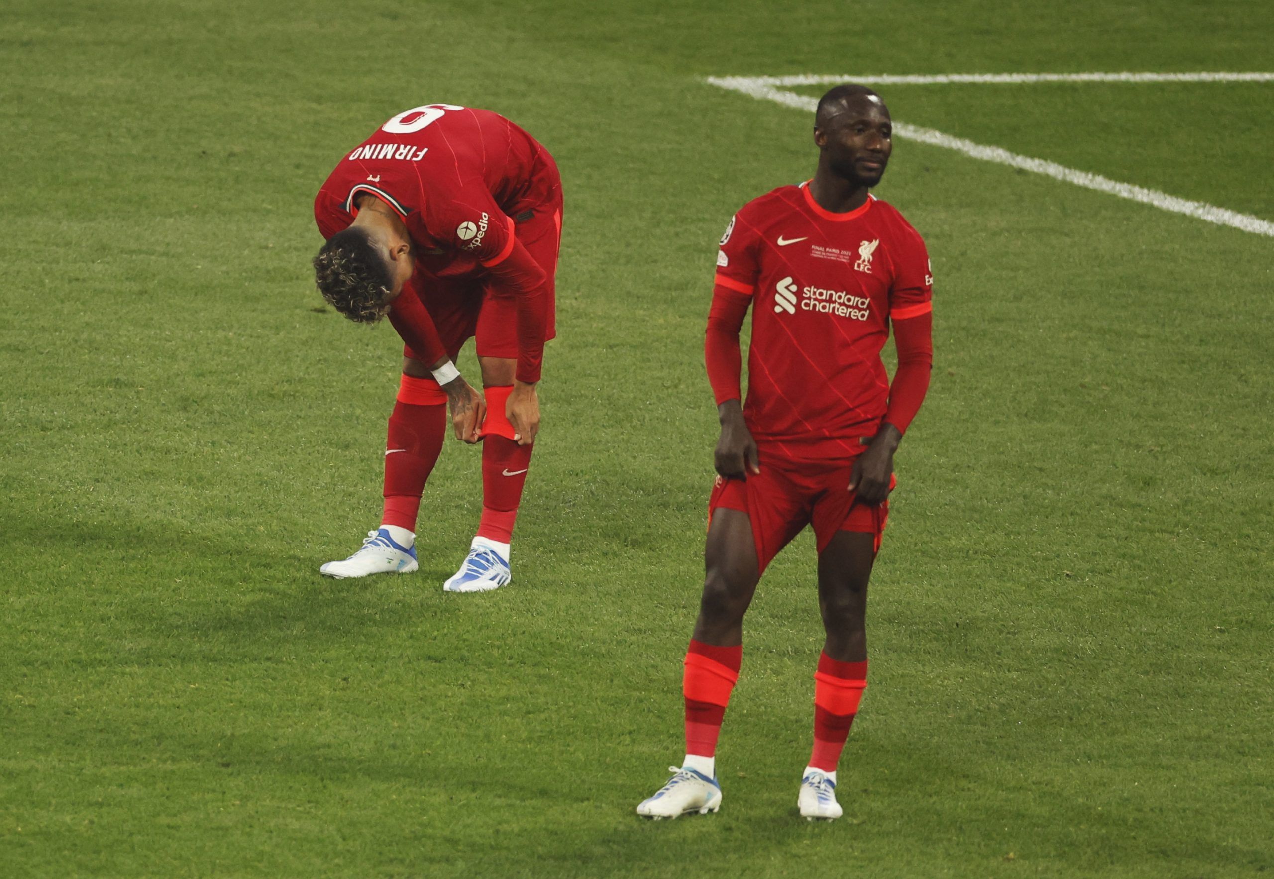 Soccer Football - Champions League Final - Liverpool v Real Madrid - Stade de France, Saint-Denis near Paris, France - May 28, 2022  Liverpool's Roberto Firmino and Naby Keita look dejected after losing the Champions League final REUTERS/Gonzalo Fuentes