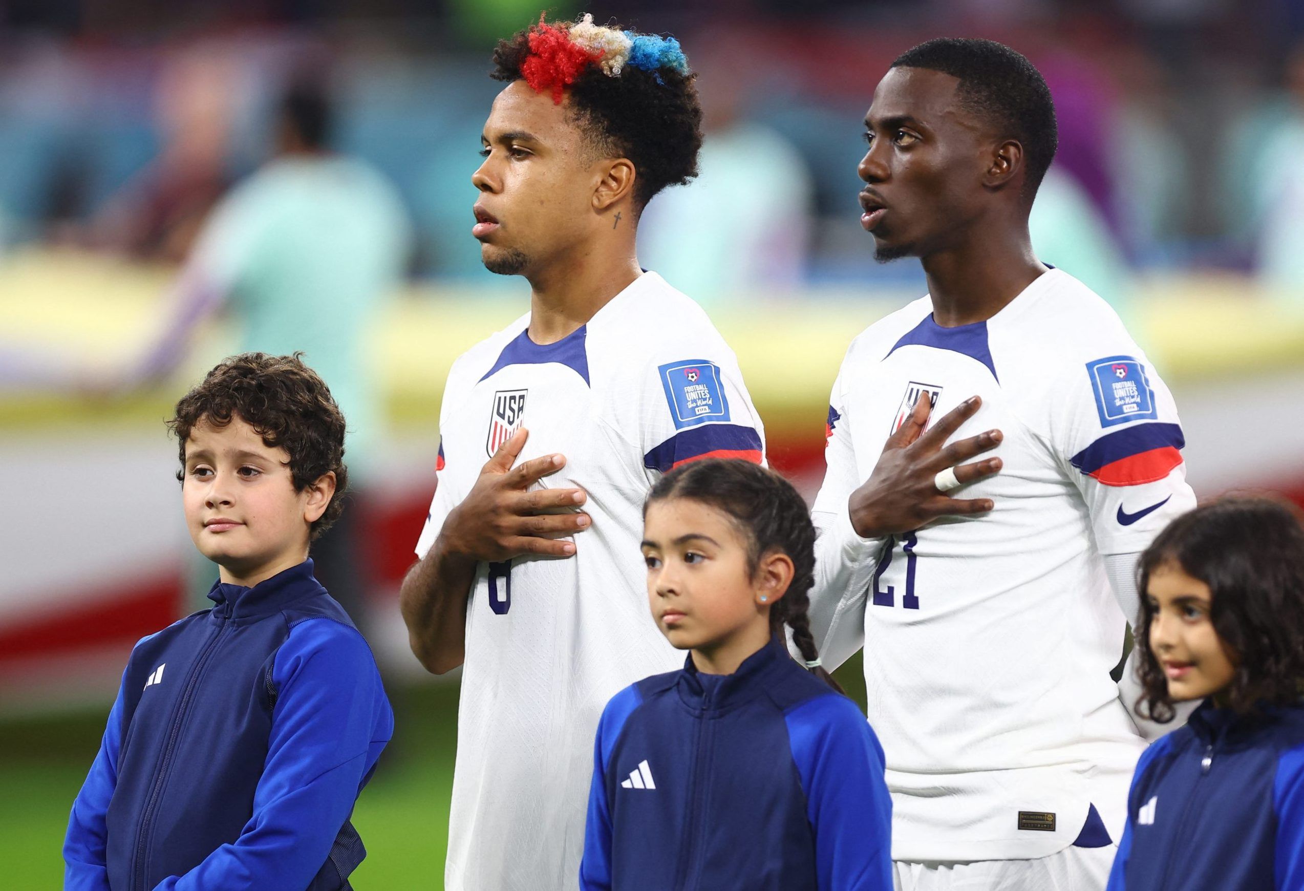 Weston McKennie and Timothy Weah of the U.S. line up before the match