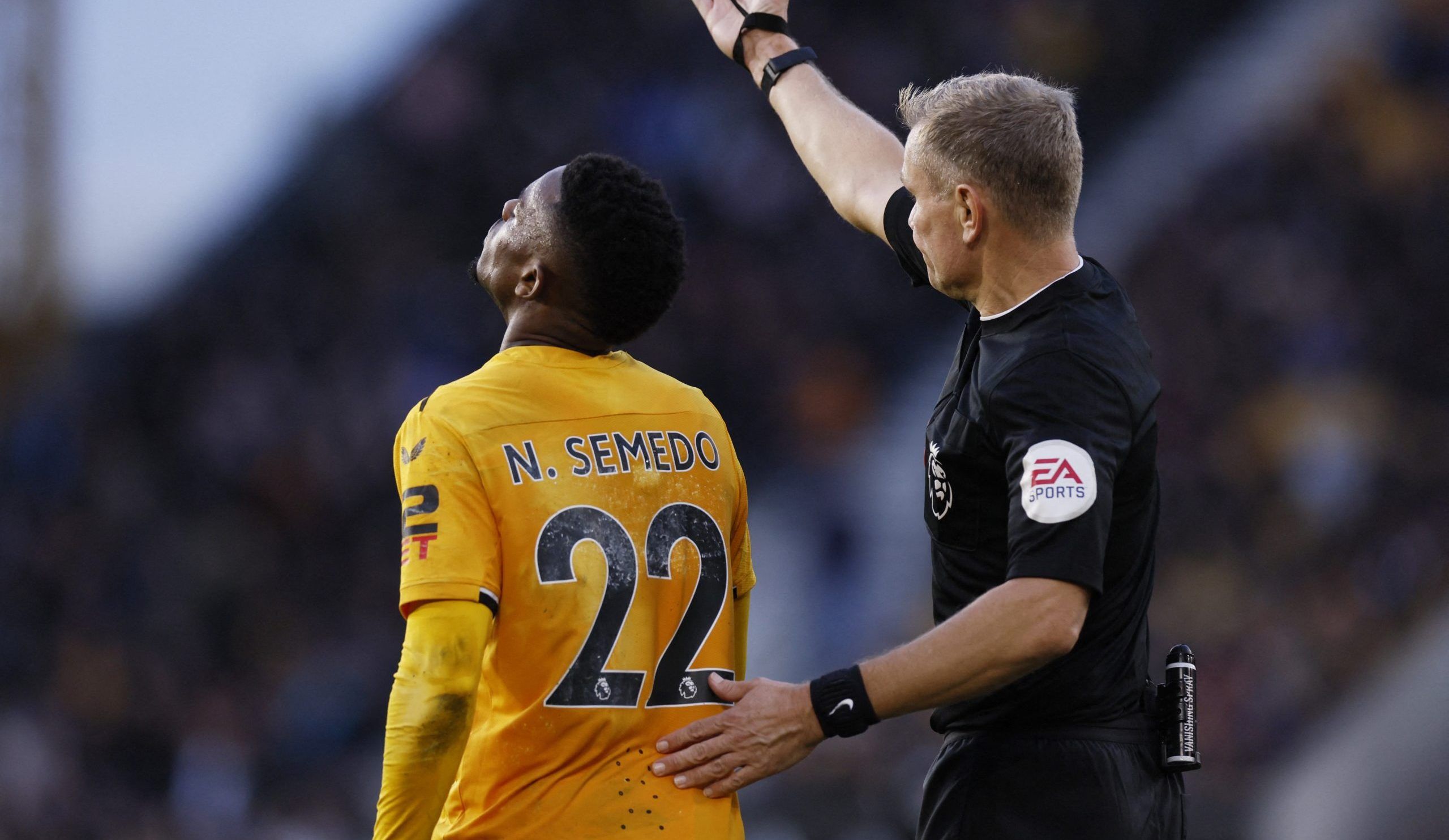 Soccer Football - Premier League - Wolverhampton Wanderers v Brighton &amp; Hove Albion - Molineux Stadium, Wolverhampton, Britain - November 5, 2022  Wolverhampton Wanderers' Nelson Semedo reacts after being shown a red card by referee Graham Scott Action Images via Reuters/Andrew Couldridge EDITORIAL USE ONLY. No use with unauthorized audio, video, data, fixture lists, club/league logos or 'live' services. Online in-match use limited to 75 images, no video emulation. No use in betting, games o
