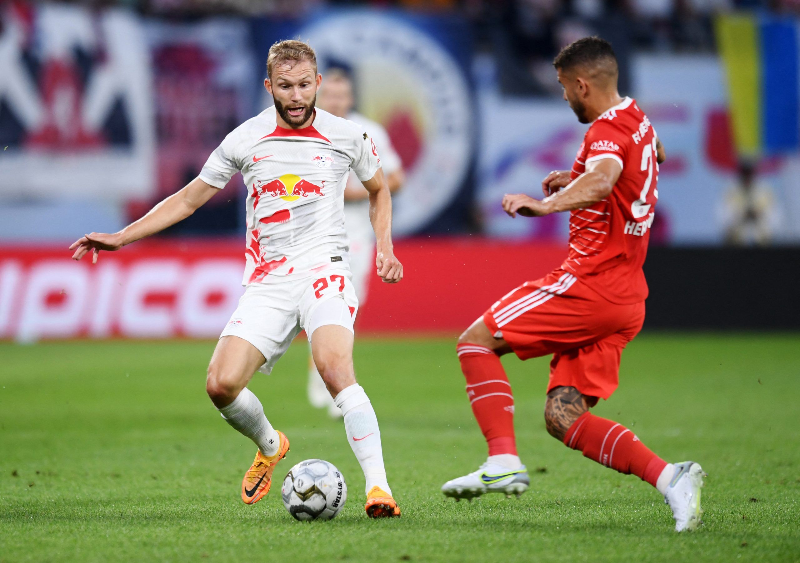 Soccer Football - DFL Super Cup - RB Leipzig v Bayern Munich - Red Bull Arena, Leipzig, Germany - July 30, 2022  RB Leipzig's Konrad Laimer in action with Bayern Munich's Lucas Hernandez REUTERS/Annegret Hilse DFL REGULATIONS PROHIBIT ANY USE OF PHOTOGRAPHS AS IMAGE SEQUENCES AND/OR QUASI-VIDEO.