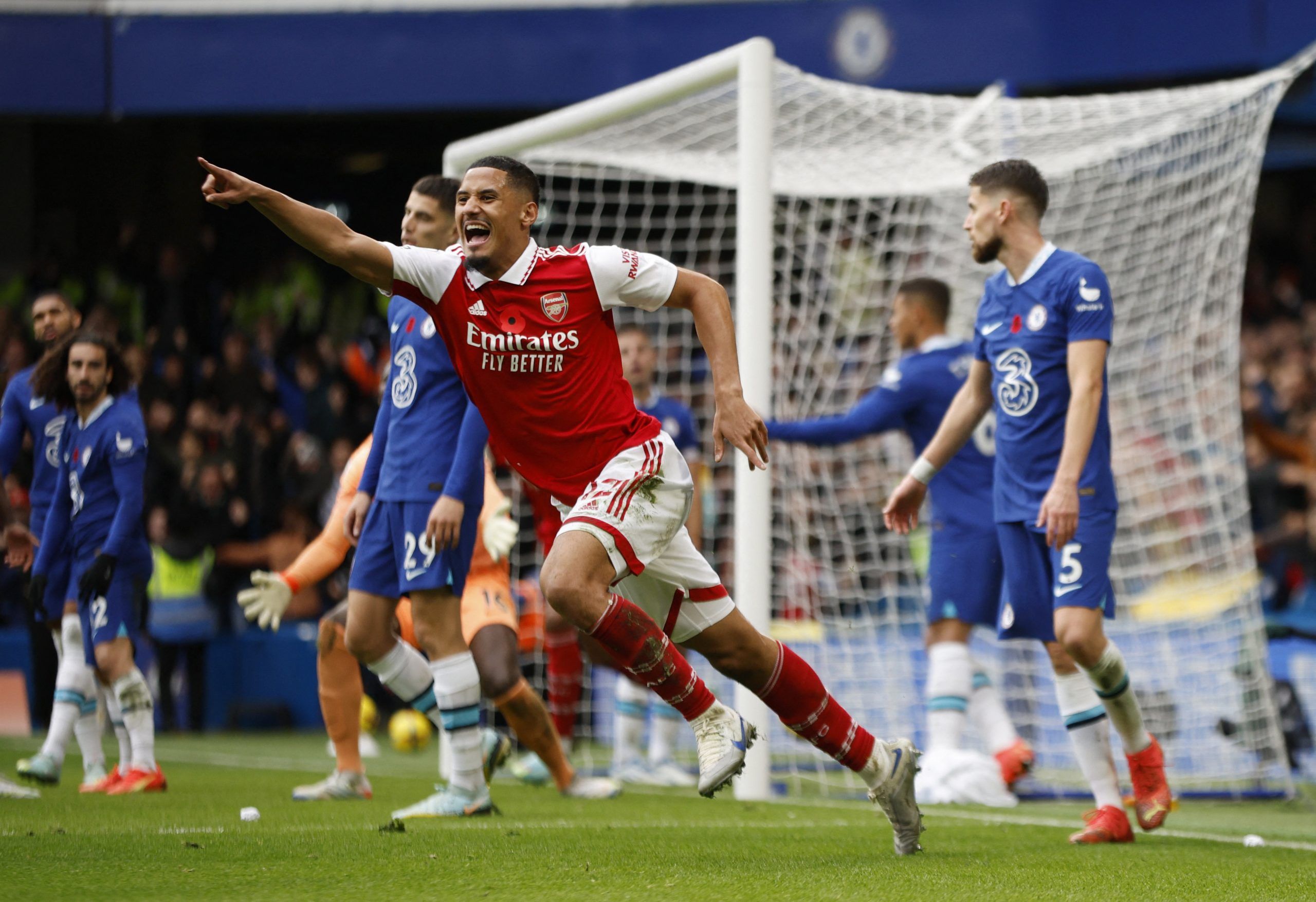 Soccer Football - Premier League - Chelsea v Arsenal - Stamford Bridge, London, Britain - November 6, 2022 Arsenal's William Saliba celebrates their first goal scored by Gabriel Action Images via Reuters/John Sibley EDITORIAL USE ONLY. No use with unauthorized audio, video, data, fixture lists, club/league logos or 'live' services. Online in-match use limited to 75 images, no video emulation. No use in betting, games or single club /league/player publications.  Please contact your account repres