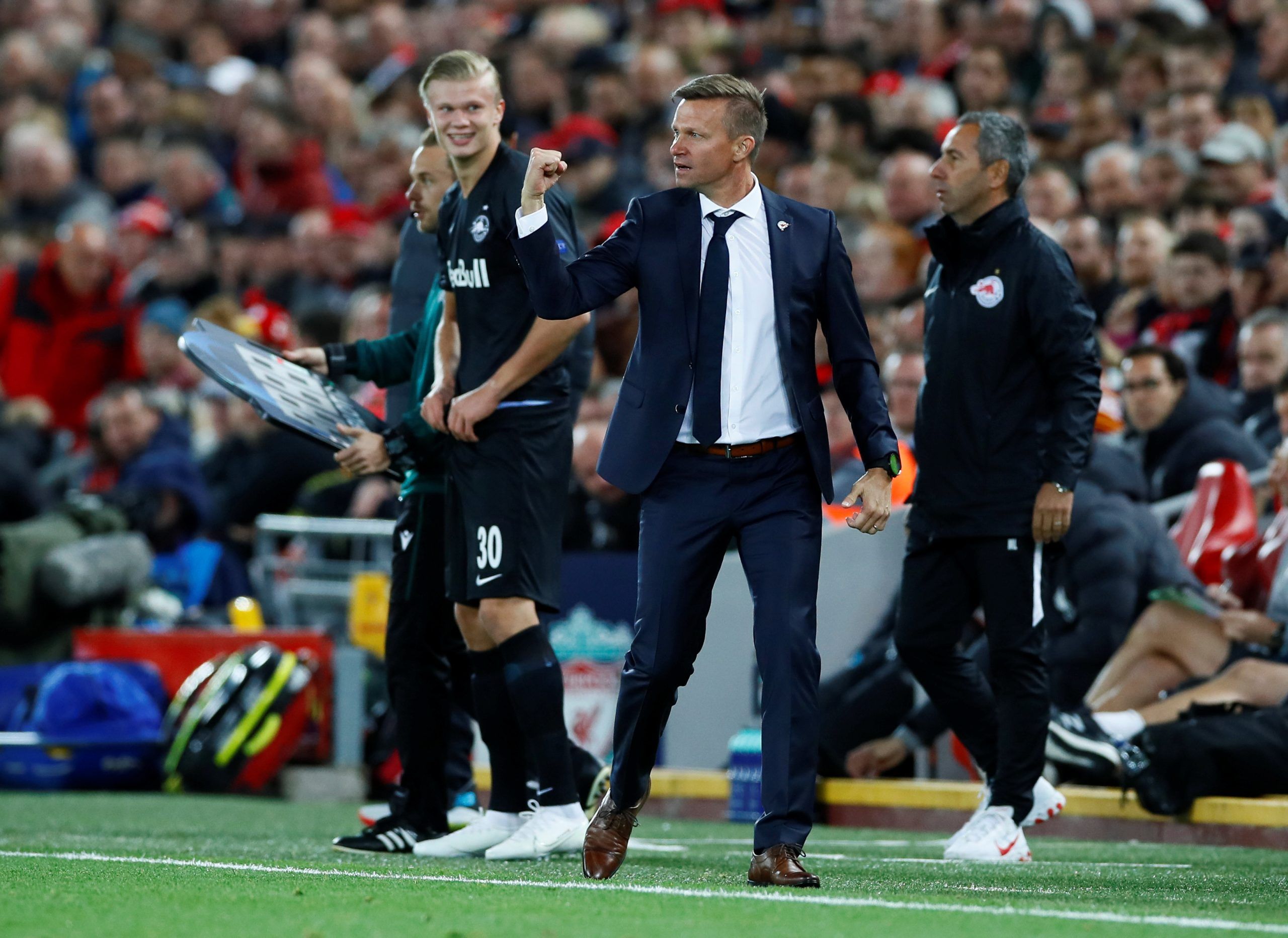 Soccer Football - Champions League - Group E - Liverpool v FC Salzburg - Anfield, Liverpool, Britain - October 2, 2019  FC Salzburg coach Jesse Marsch celebrates their second goal scored by Takumi Minamino as FC Salzburg's Erling Braut Haaland prepares to come on as a substitute                       Action Images via Reuters/Jason Cairnduff