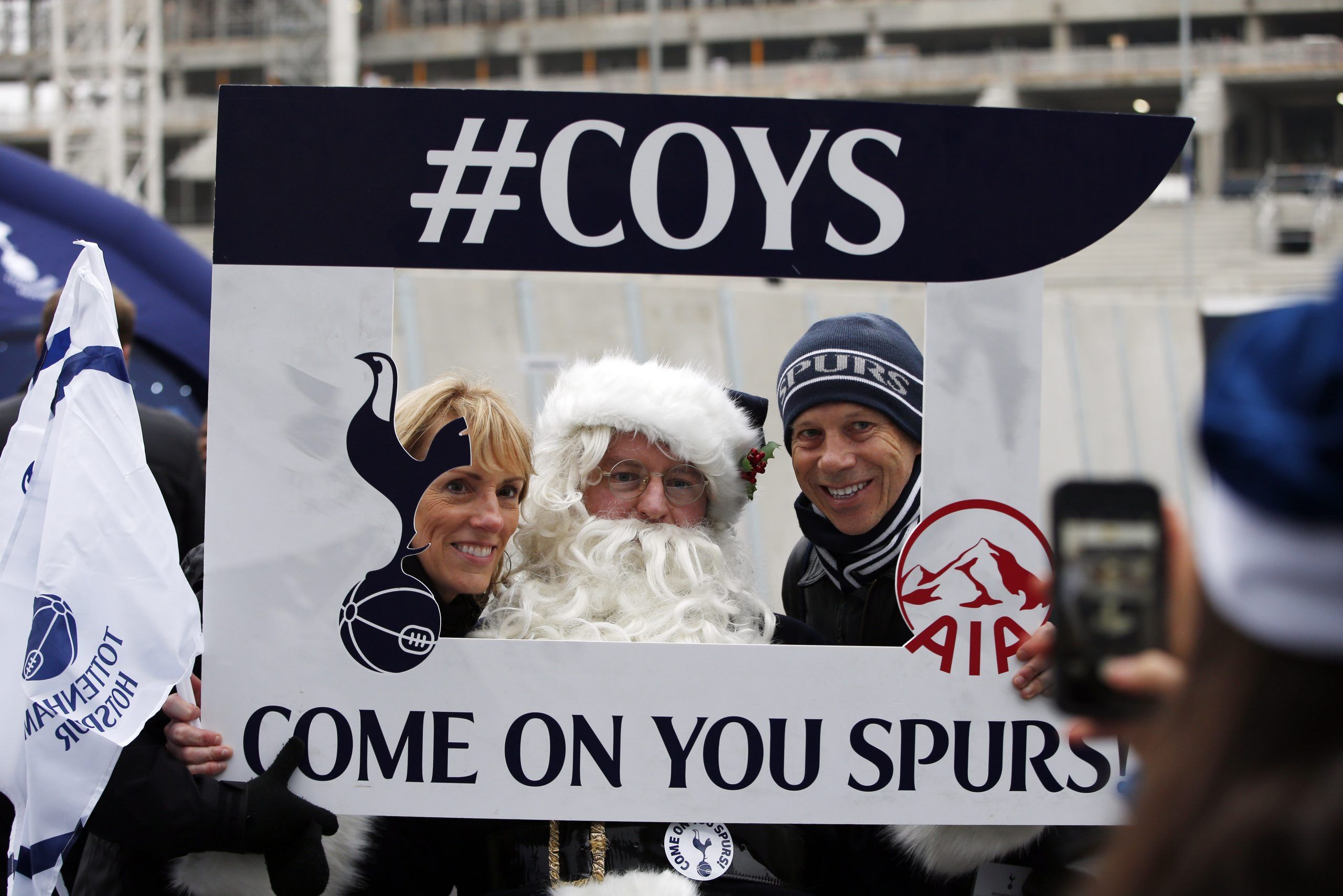 Britain Football Soccer - Tottenham Hotspur v Burnley - Premier League - White Hart Lane - 18/12/16 Father Christmas with fans outside the stadium before the match  Action Images via Reuters / Paul Childs Livepic EDITORIAL USE ONLY. No use with unauthorized audio, video, data, fixture lists, club/league logos or 