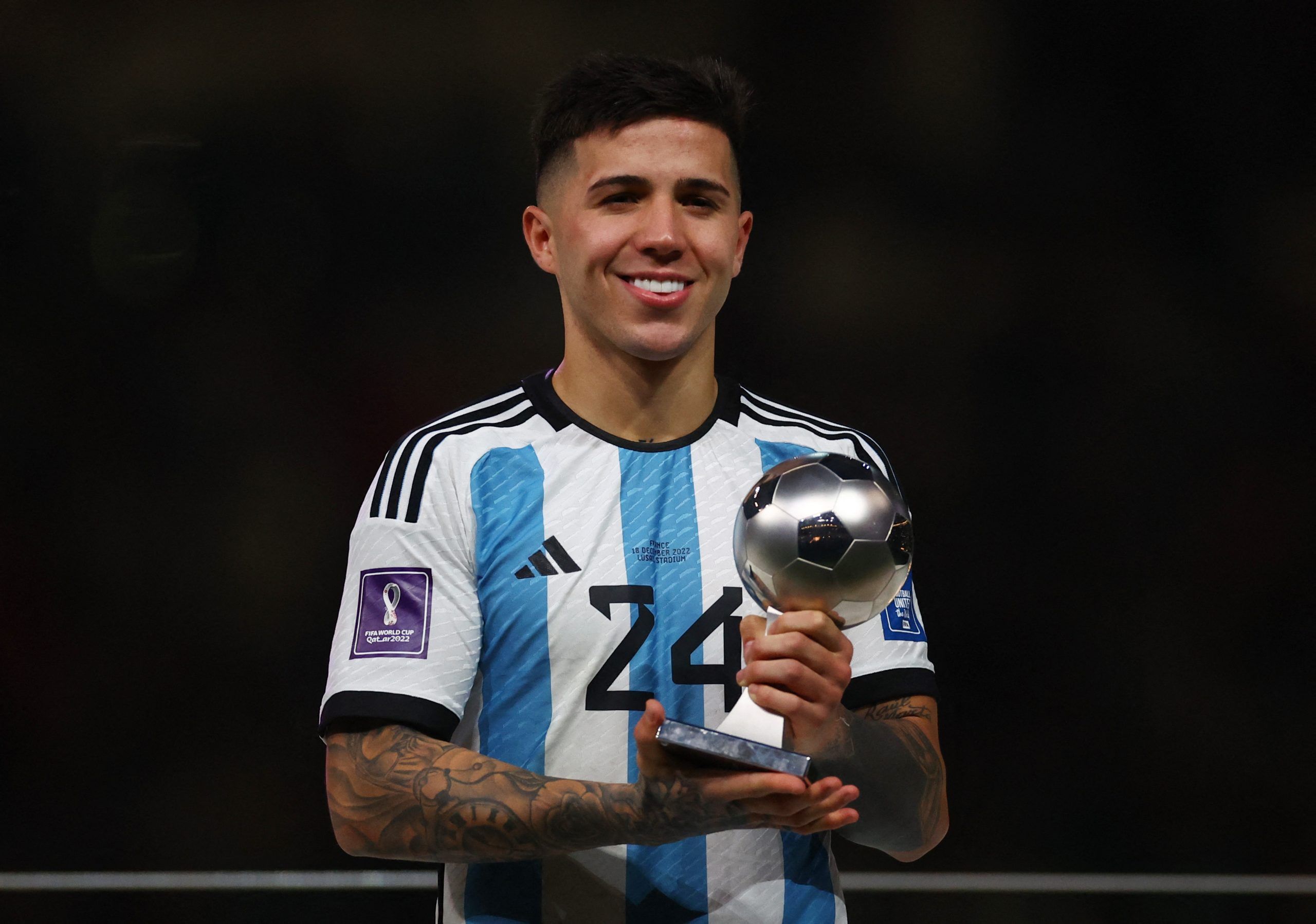 Soccer Football - FIFA World Cup Qatar 2022 - Final - Argentina v France - Lusail Stadium, Lusail, Qatar - December 18, 2022 Argentina's Enzo Fernandez poses with his Best Young Player award during the award ceremony after the match REUTERS/Kai Pfaffenbach
