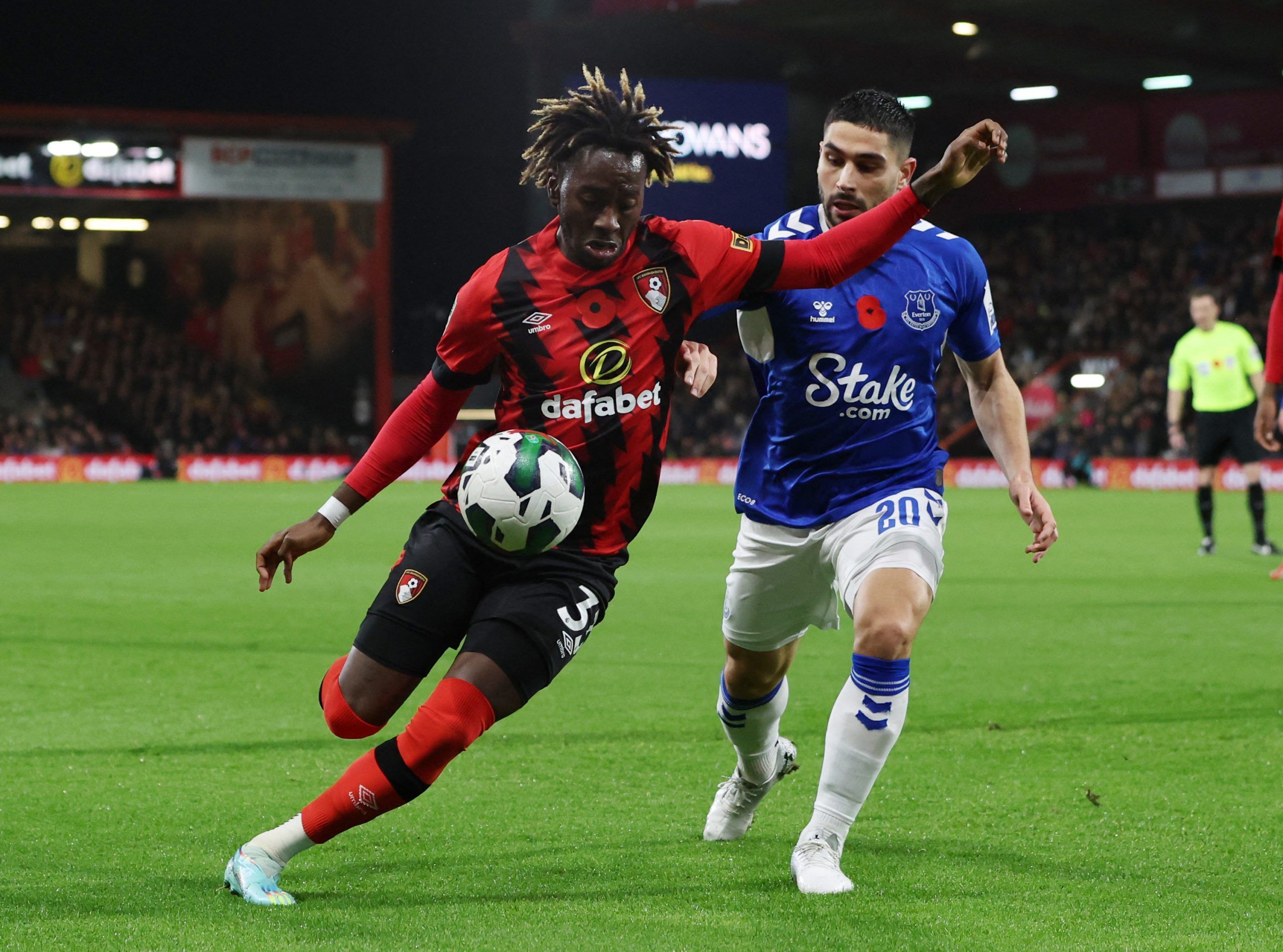 Soccer Football - Carabao Cup Third Round - AFC Bournemouth v Everton - Vitality Stadium, Bournemouth, Britain - November 8, 2022 AFC Bournemouth's Jordan Zemura in action with Everton's Neal Maupay Action Images via Reuters/Paul Childs EDITORIAL USE ONLY. No use with unauthorized audio, video, data, fixture lists, club/league logos or 'live' services. Online in-match use limited to 75 images, no video emulation. No use in betting, games or single club /league/player publications.  Please contac