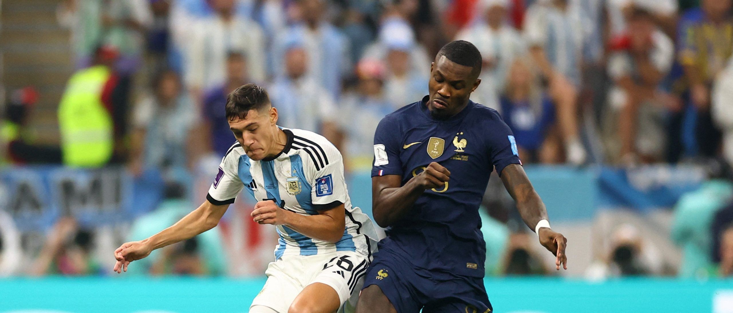 Soccer Football - FIFA World Cup Qatar 2022 - Final - Argentina v France - Lusail Stadium, Lusail, Qatar - December 18, 2022 Argentina's Nahuel Molina in action with France's Marcus Thuram REUTERS/Carl Recine