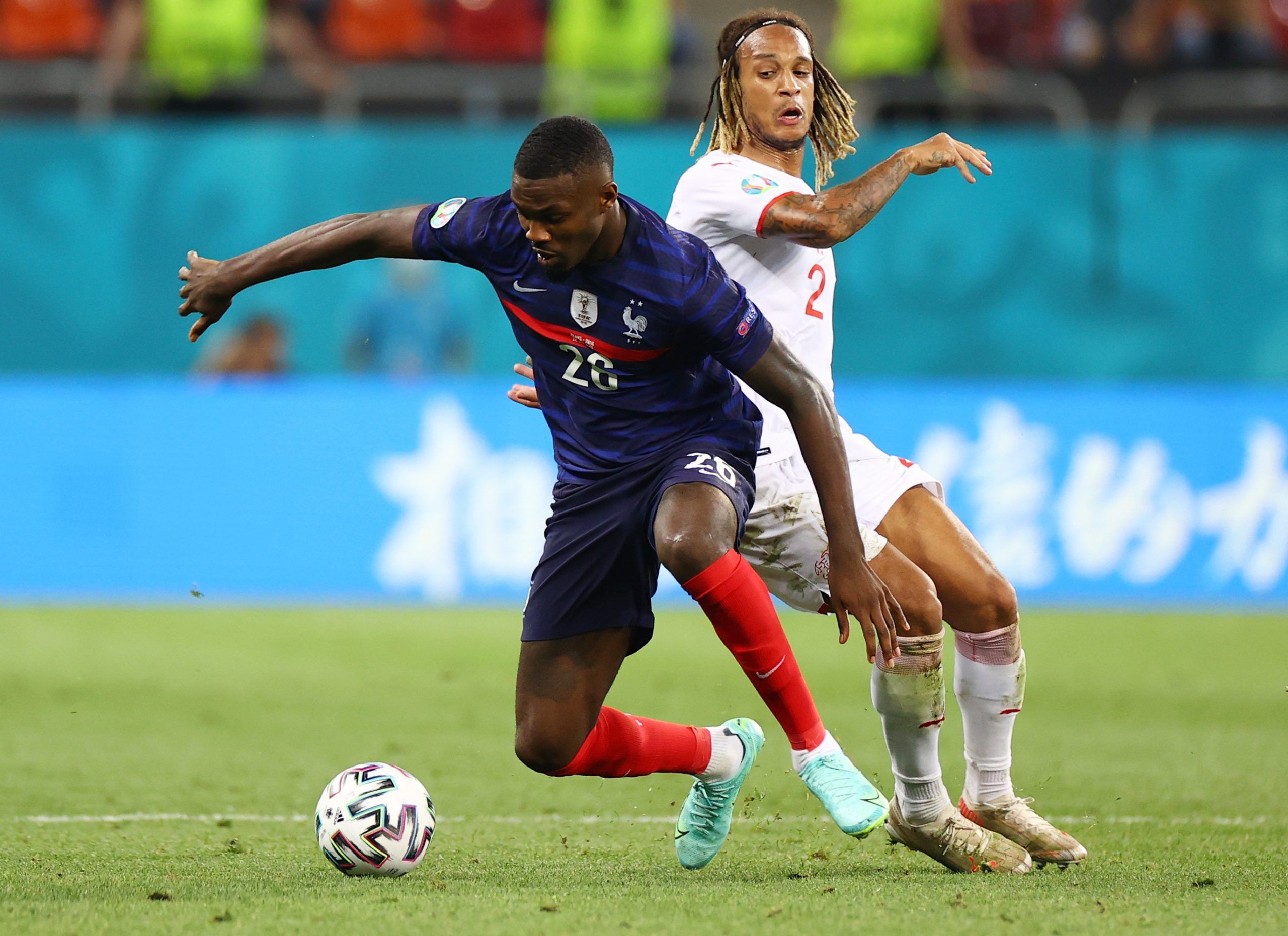 Soccer Football - Euro 2020 - Round of 16 - France v Switzerland - National Arena Bucharest, Bucharest, Romania - June 29, 2021   France's Marcus Thuram in action with Switzerland's Kevin Mbabu Pool via REUTERS/Marko Djurica
