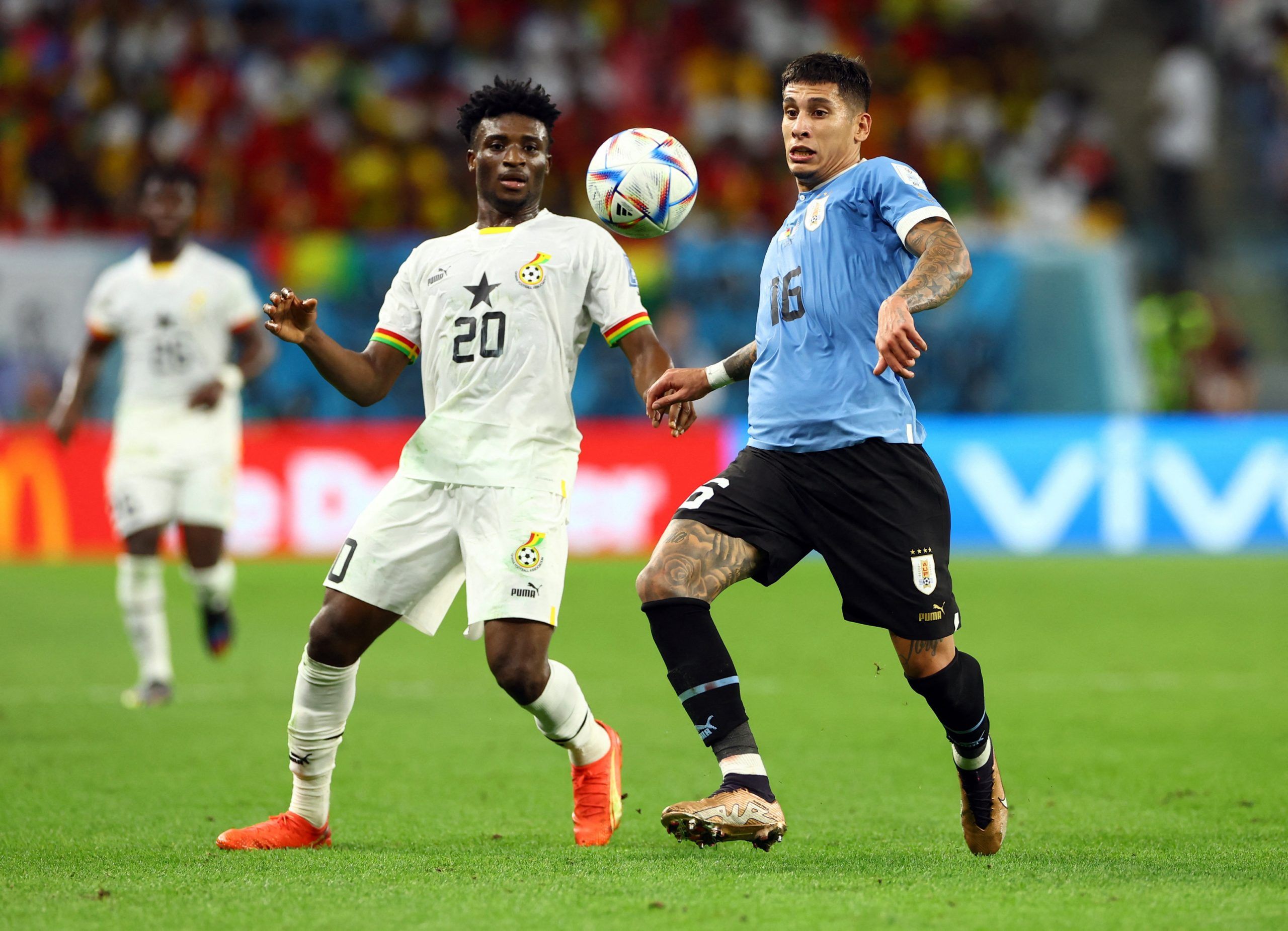 Ghana's Mohammed Kudus in action with Uruguay's Mathias Olivera
