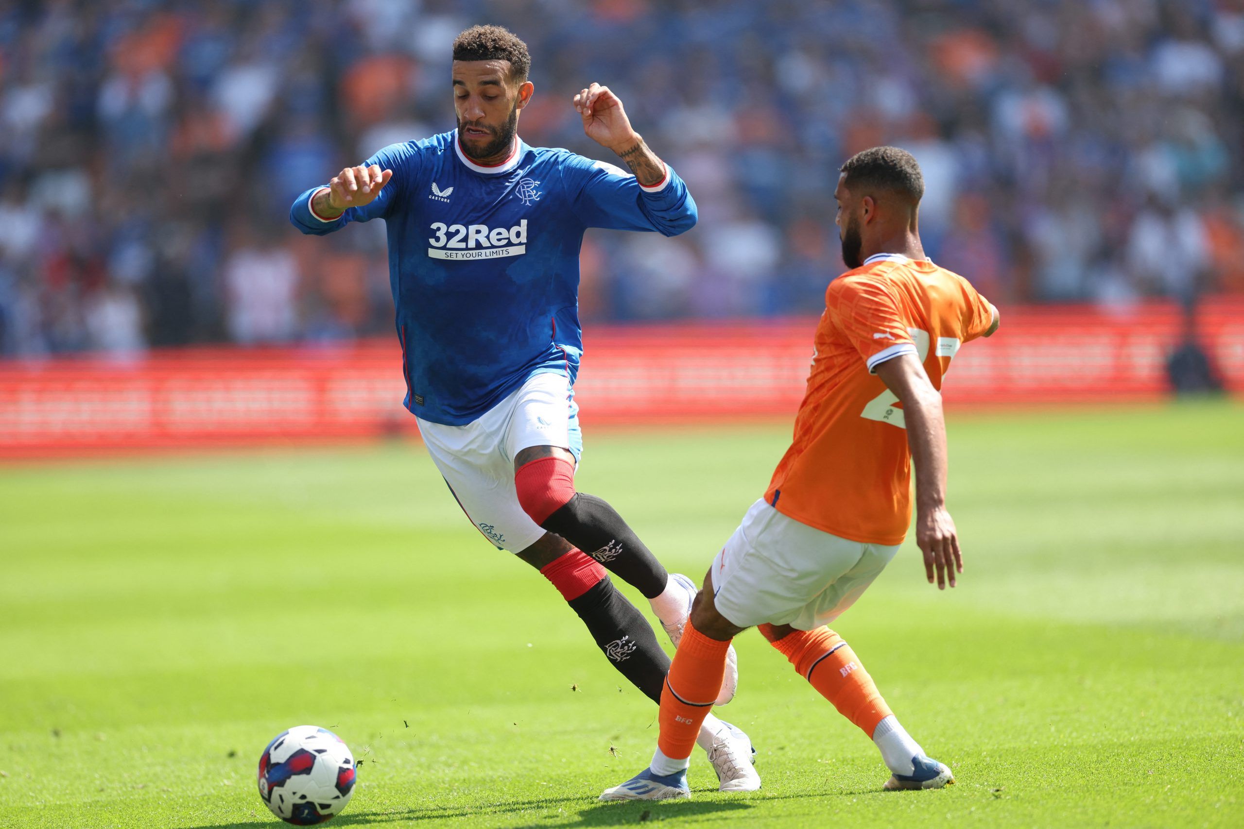 Soccer Football - Pre Season Friendly - Blackpool v Rangers - Bloomfield Road, Blackpool, Britain - July 16, 2022 Rangers' Connor Goldson in action with Blackpool's CJ Hamilton Action Images via Reuters/Carl Recine