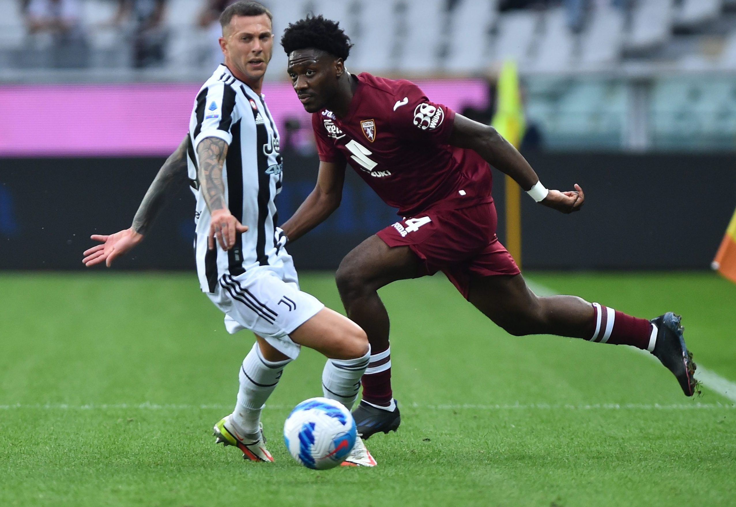 Juventus' Federico Bernardeschi in action with Torino's Ola Aina