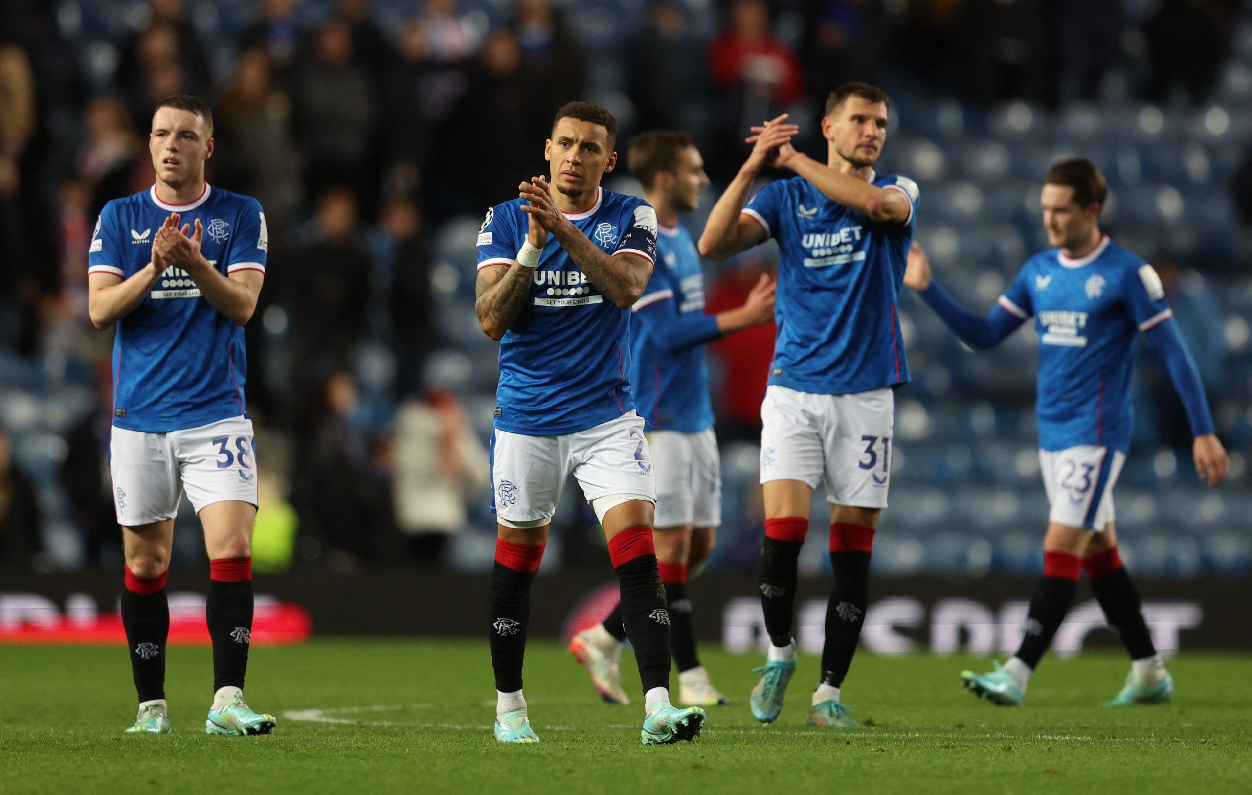 Soccer Football - Champions League - Group A - Rangers v Ajax Amsterdam - Ibrox Stadium, Glasgow, Scotland, Britain - November 1, 2022  Rangers' James Tavernier and Leon Thomson King look dejected after the match REUTERS/Russell Cheyne