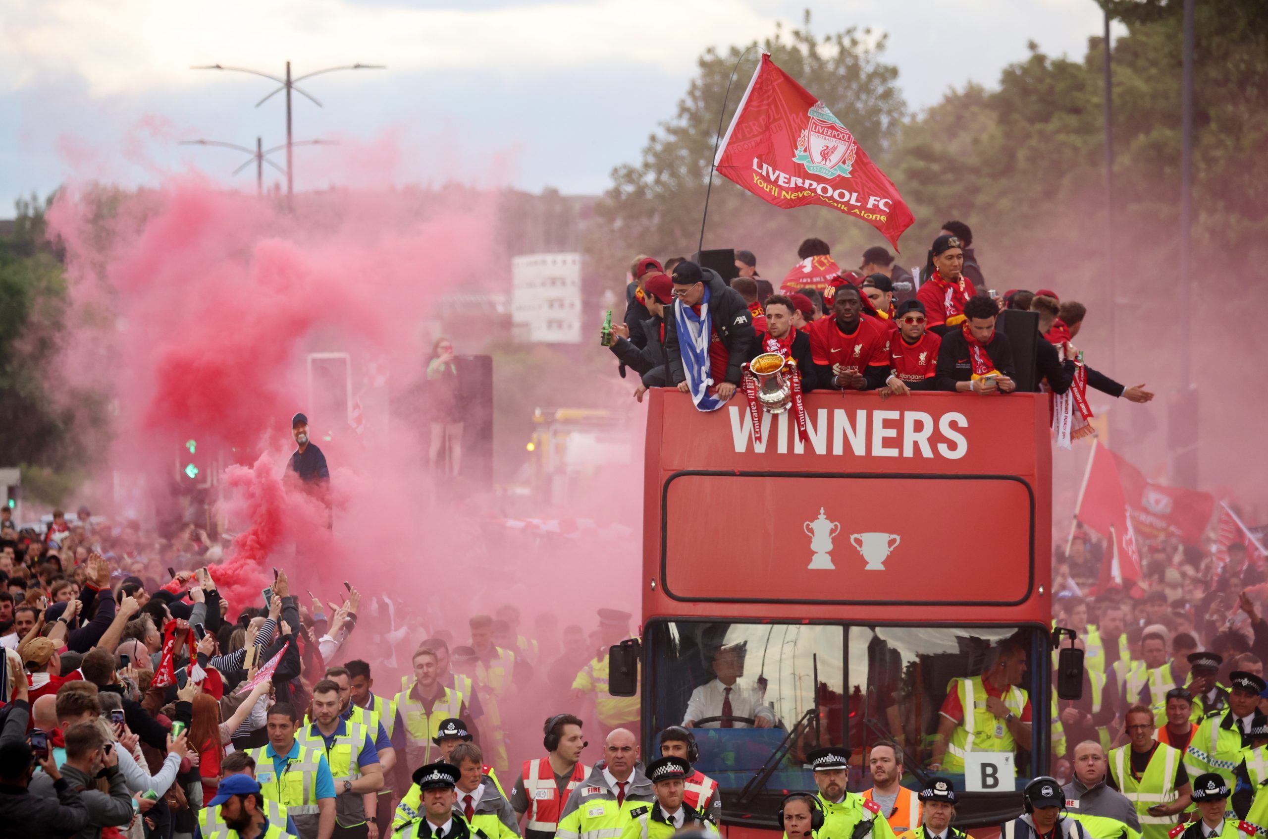 Soccer Football - Liverpool victory parade - Liverpool, Britain - May 29, 2022 Liverpool's Diogo Jota holds the FA Cup alongside Ibrahima Konate, Luis Diaz and Curtis Jones on board an open top bus during the victory parade REUTERS/Phil Noble