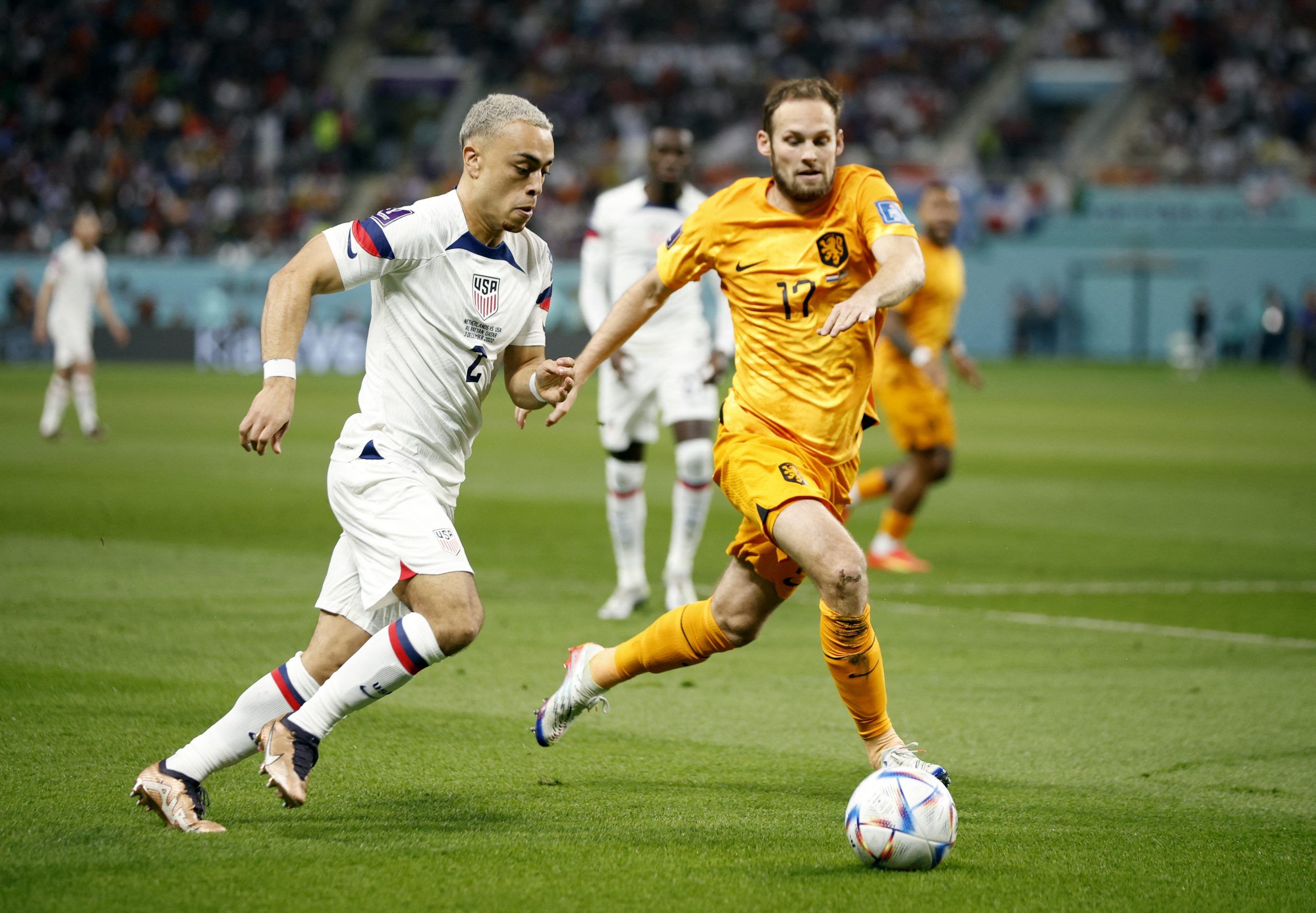 Sergino Dest of the U.S. in action with Netherlands' Daley Blind