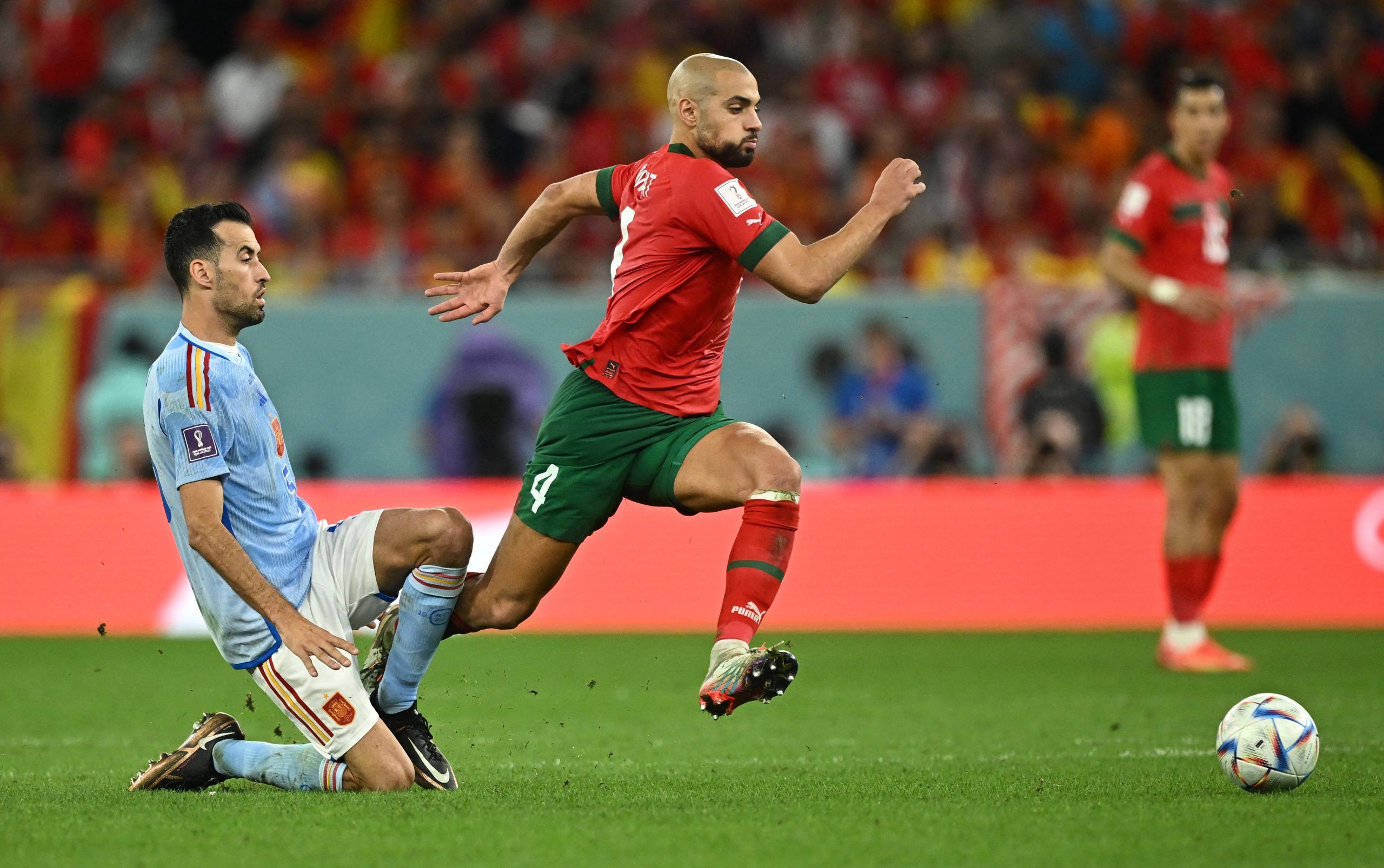 Spain's Sergio Busquets in action with Morocco's Sofyan Amrabat