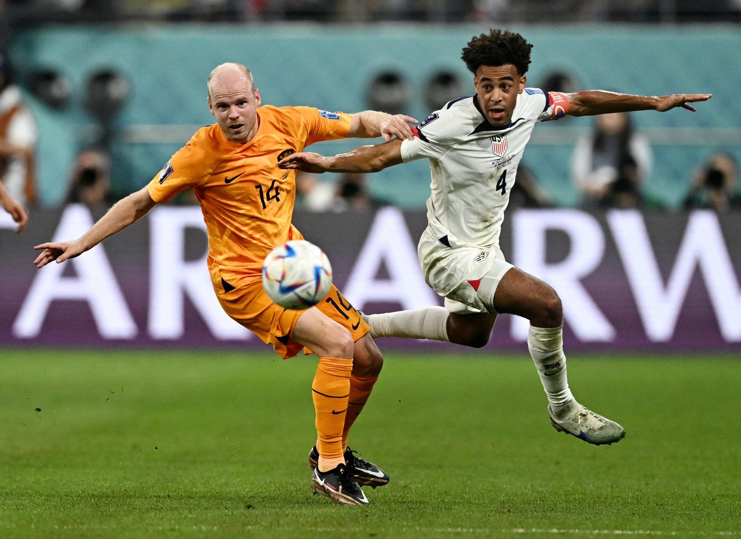 Soccer Football - FIFA World Cup Qatar 2022 - Round of 16 - Netherlands v United States - Khalifa International Stadium, Doha, Qatar - December 3, 2022 Tyler Adams of the U.S. in action with Netherlands' Davy Klaassen REUTERS/Dylan Martinez