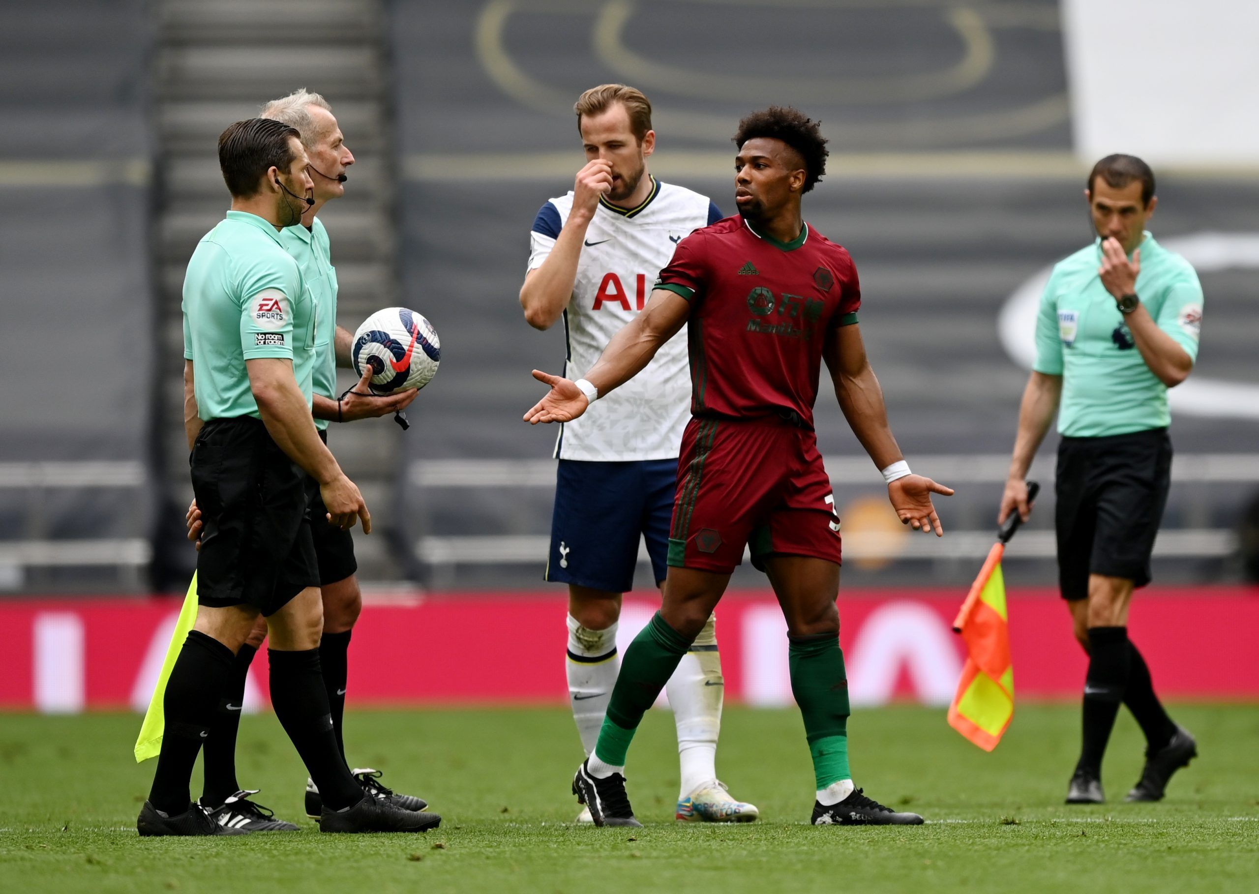 Wolverhampton Wanderers' Adama Traore remonstrates with referee Martin Atkinson at half time vs Spurs