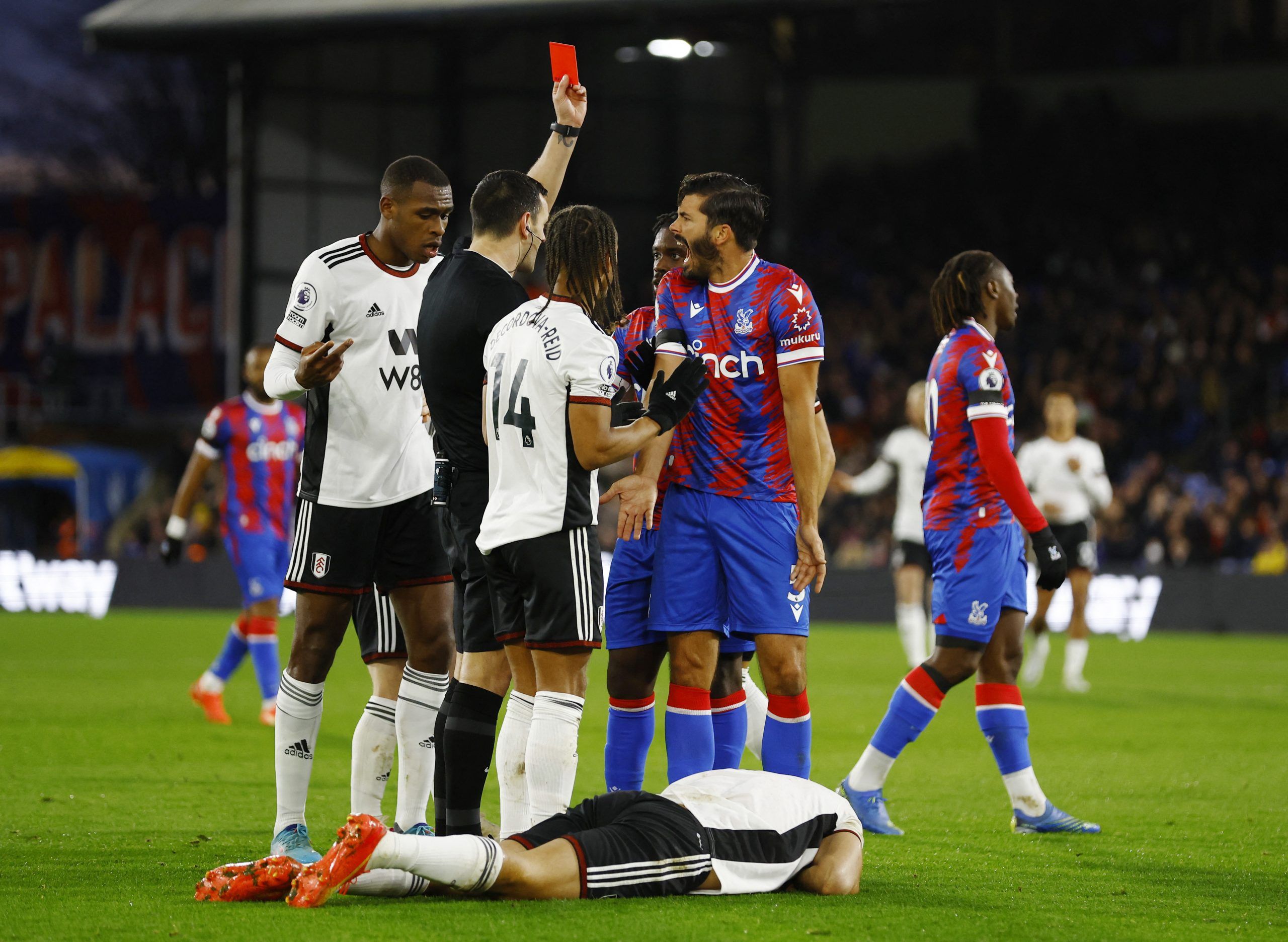 Soccer Football - Premier League - Crystal Palace v Fulham - Selhurst Park, London, Britain - December 26, 2022 Crystal Palace's James Tomkins is shown a red card by referee Andrew Madley Action Images via Reuters/Peter Cziborra EDITORIAL USE ONLY. No use with unauthorized audio, video, data, fixture lists, club/league logos or 'live' services. Online in-match use limited to 75 images, no video emulation. No use in betting, games or single club /league/player publications.  Please contact your a