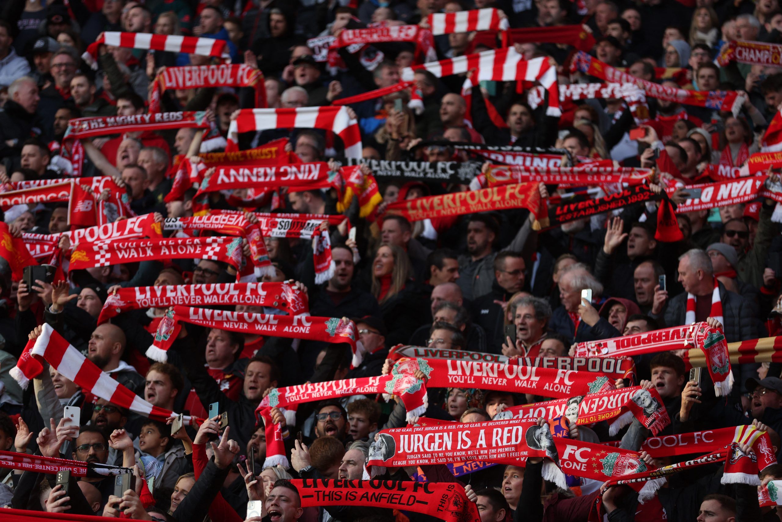 Soccer Football - Premier League - Liverpool v Southampton - Anfield, Liverpool, Britain - November 12, 2022 Liverpool fans with scarves inside the stadium before the match REUTERS/Russell Cheyne EDITORIAL USE ONLY. No use with unauthorized audio, video, data, fixture lists, club/league logos or 'live' services. Online in-match use limited to 75 images, no video emulation. No use in betting, games or single club /league/player publications.  Please contact your account representative for further