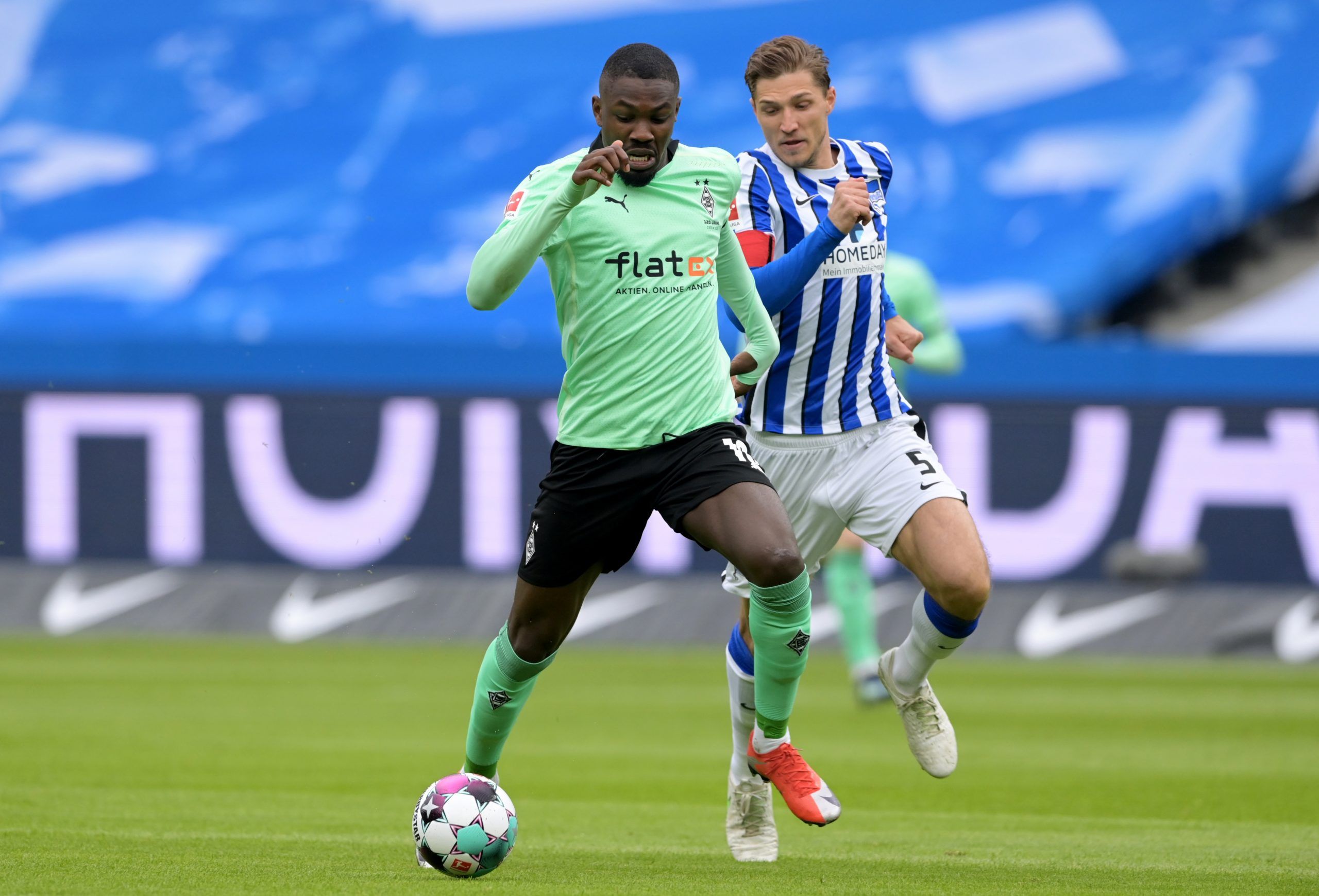 Soccer Football - Bundesliga - Hertha BSC v Borussia Moenchengladbach - Olympiastadion, Berlin, Germany - April 10, 2021 Borussia Moenchengladbach's Marcus Thuram in action with Hertha BSC's Niklas Stark Pool via REUTERS/Soeren Stache DFL regulations prohibit any use of photographs as image sequences and/or quasi-video.