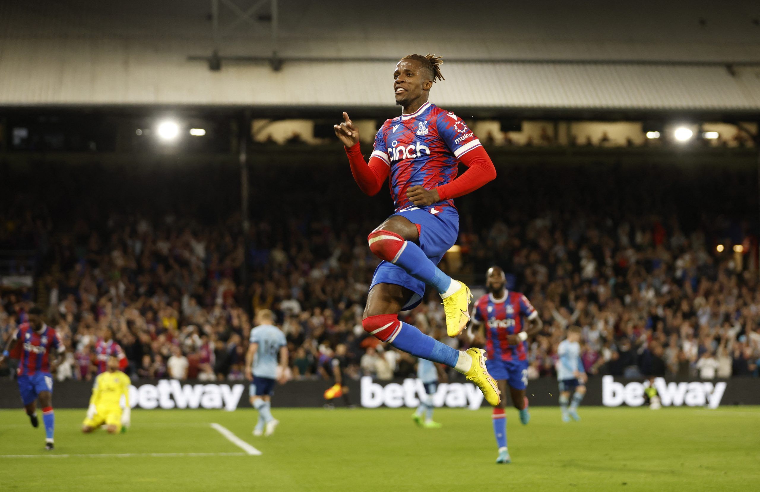 Soccer Football - Premier League - Crystal Palace v Brentford - Selhurst Park, London, Britain - August 30, 2022 Crystal Palace's Wilfried Zaha celebrates scoring their first goal Action Images via Reuters/Peter Cziborra EDITORIAL USE ONLY. No use with unauthorized audio, video, data, fixture lists, club/league logos or 'live' services. Online in-match use limited to 75 images, no video emulation. No use in betting, games or single club /league/player publications.  Please contact your account r
