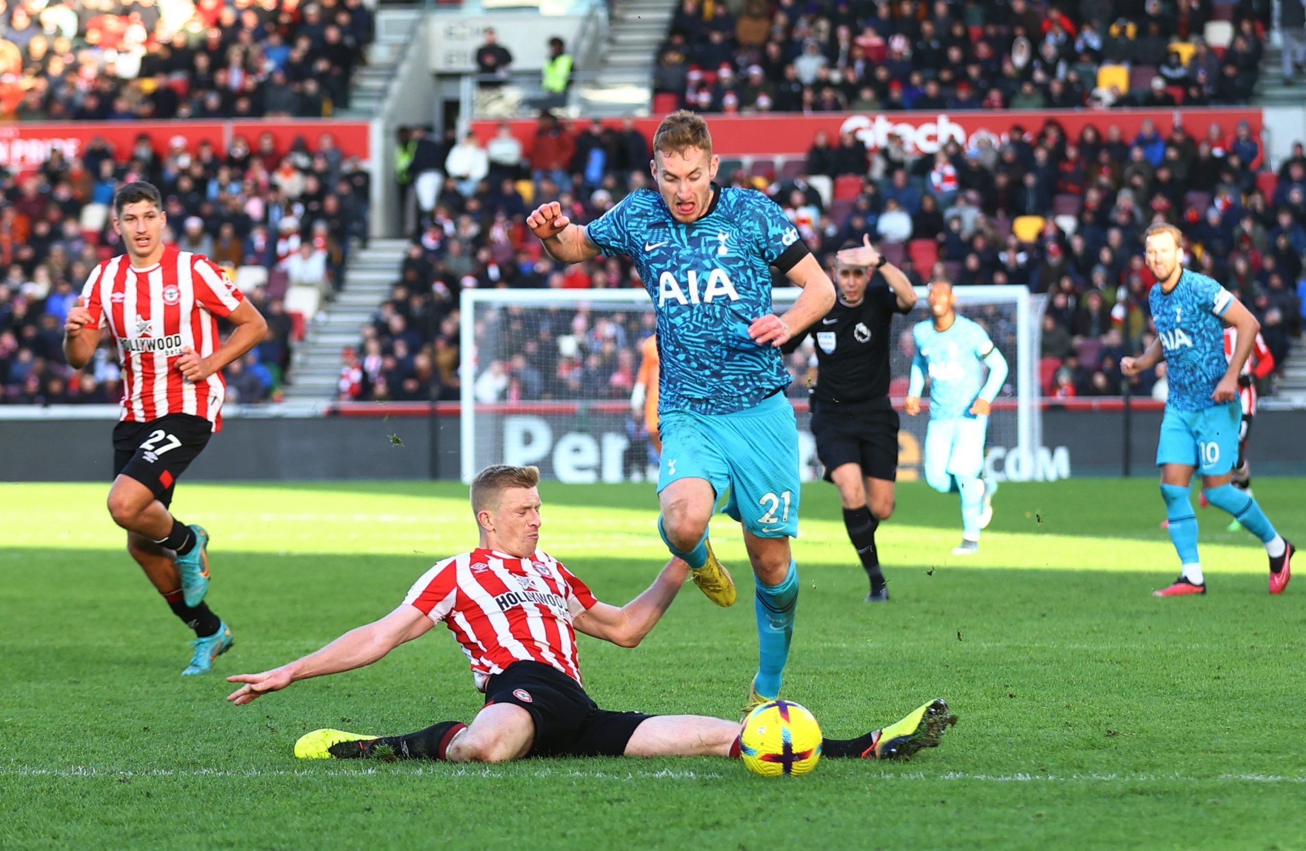 Soccer Football - Premier League - Brentford v Tottenham Hotspur - Brentford Community Stadium, London, Britain - December 26, 2022 Brentford's Ben Mee in action with Tottenham Hotspur's Dejan Kulusevski Action Images via Reuters/Matthew Childs EDITORIAL USE ONLY. No use with unauthorized audio, video, data, fixture lists, club/league logos or 'live' services. Online in-match use limited to 75 images, no video emulation. No use in betting, games or single club /league/player publications.  Pleas