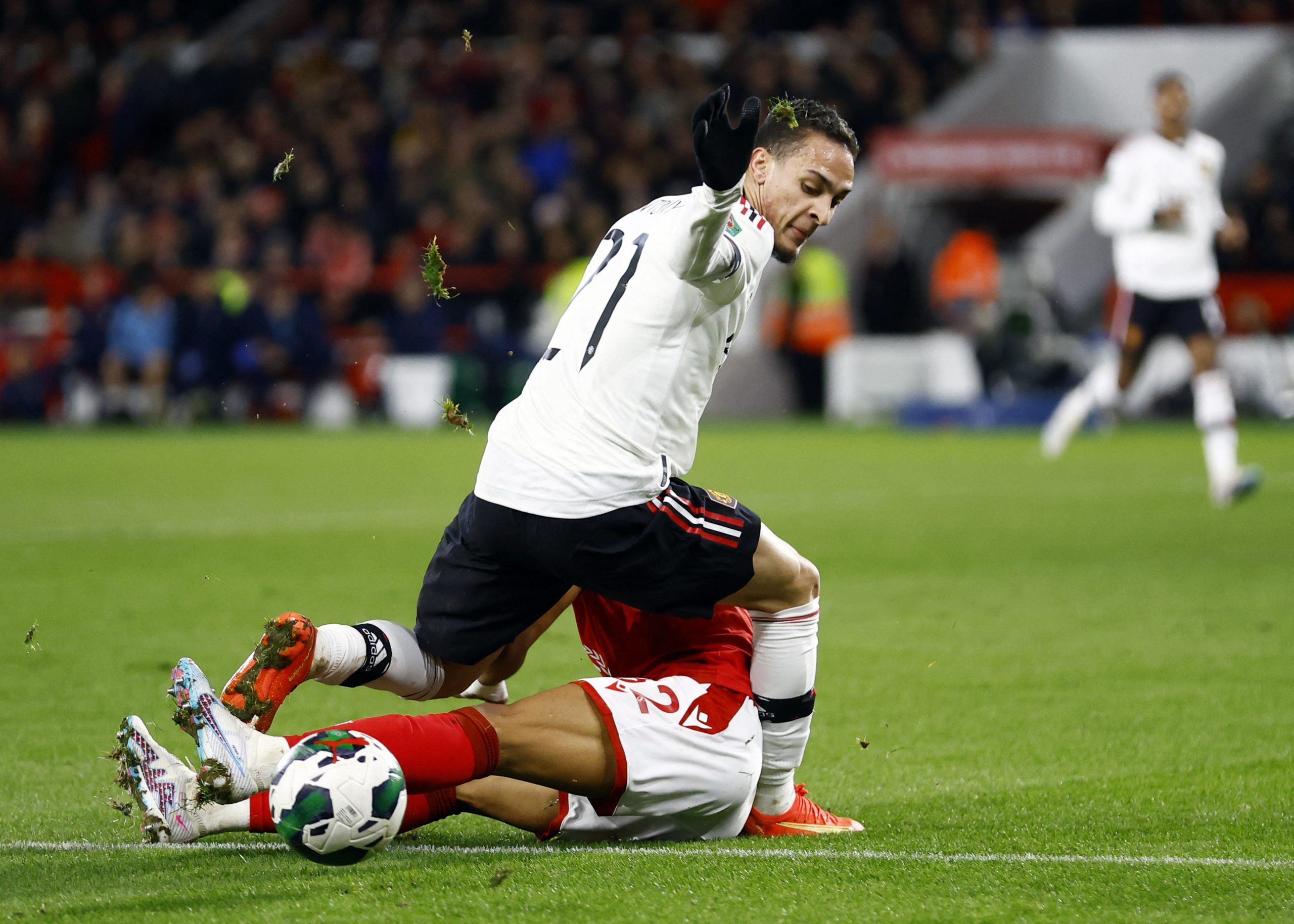 Soccer Football - Carabao Cup - Semi Final - First Leg - Nottingham Forest v Manchester United - The City Ground, Nottingham, Britain - January 25, 2023 Manchester United's Antony in action with Nottingham Forest's Renan Lodi Action Images via Reuters/Peter Cziborra