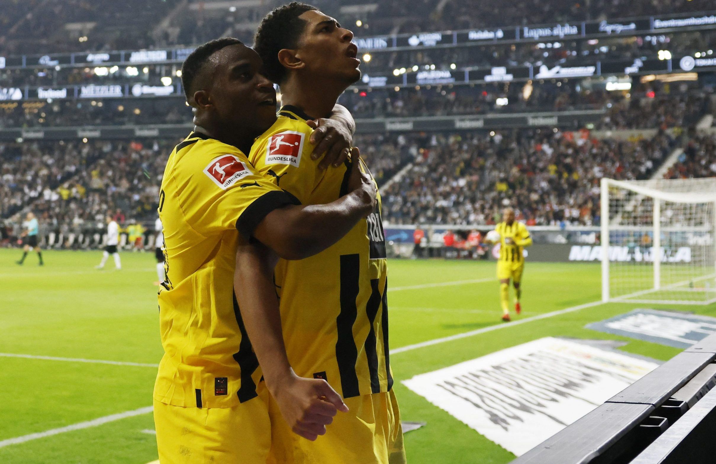 Borussia Dortmund's Jude Bellingham celebrates scoring their second goal with Youssoufa Moukoko
