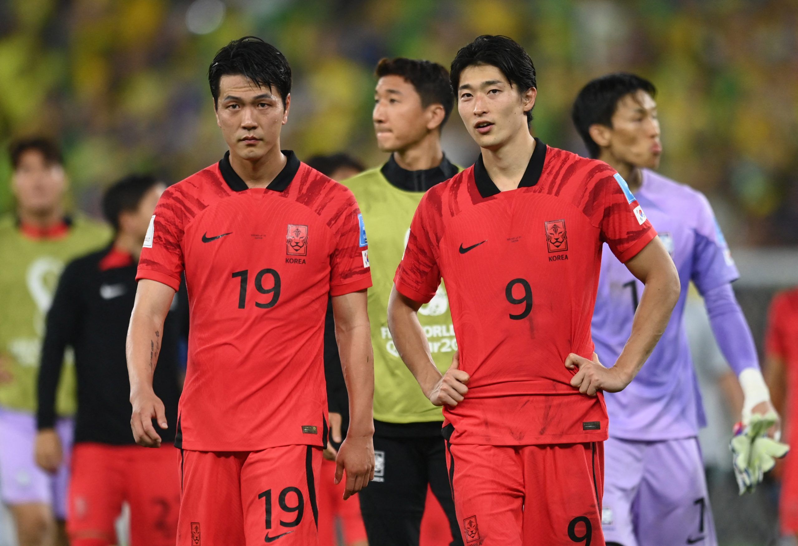 Soccer Football - FIFA World Cup Qatar 2022 - Round of 16 - Brazil v South Korea - Stadium 974, Doha, Qatar - December 5, 2022 South Korea's Kim Young-gwon and Cho Gue-sung look dejected after the match as South Korea are eliminated from the World Cup REUTERS/Annegret Hilse