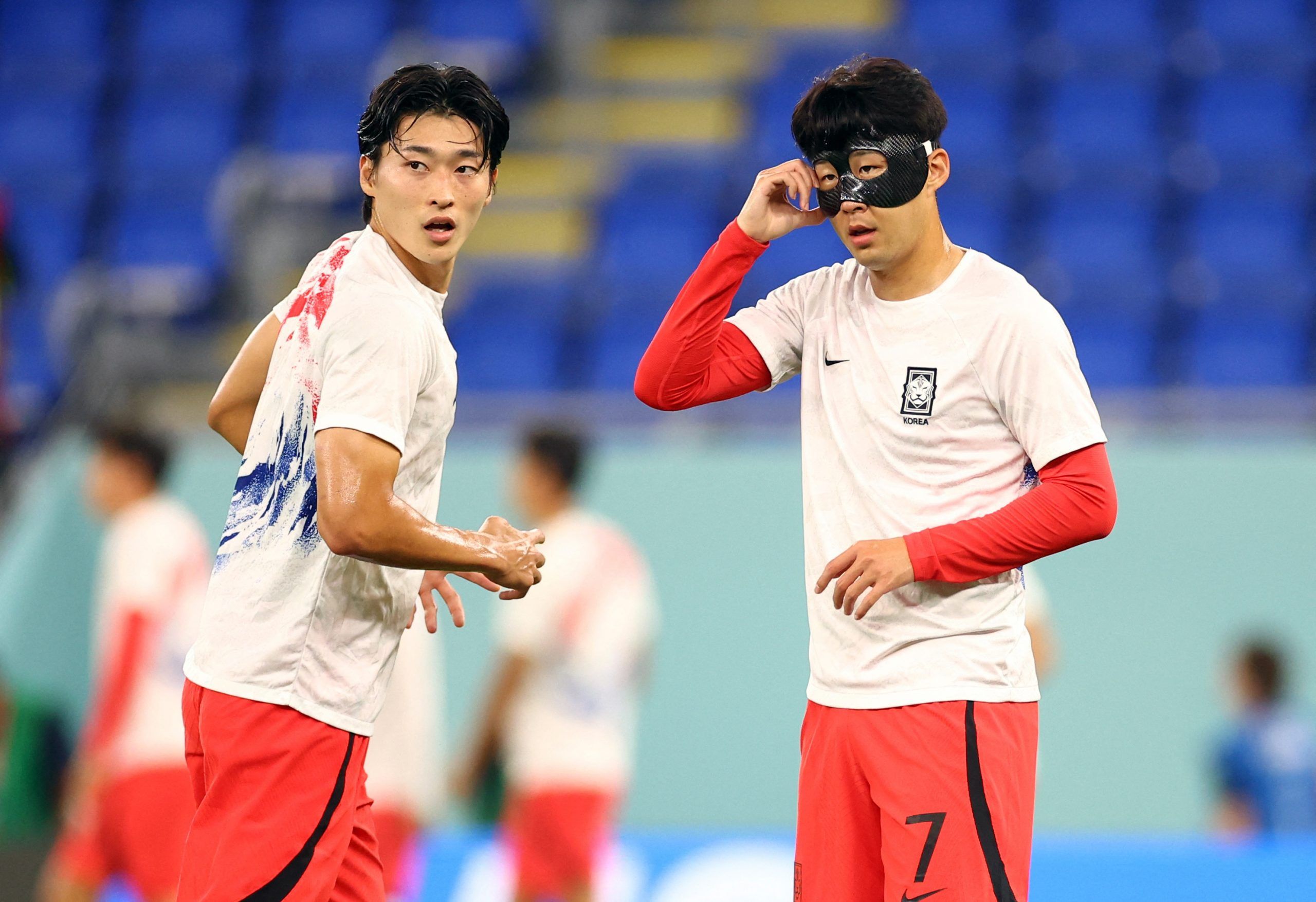 Soccer Football - FIFA World Cup Qatar 2022 - Round of 16 - Brazil v South Korea - Stadium 974, Doha, Qatar - December 5, 2022 South Korea's Cho Gue-sung and Son Heung-min during the warm up before the match REUTERS/Carl Recine